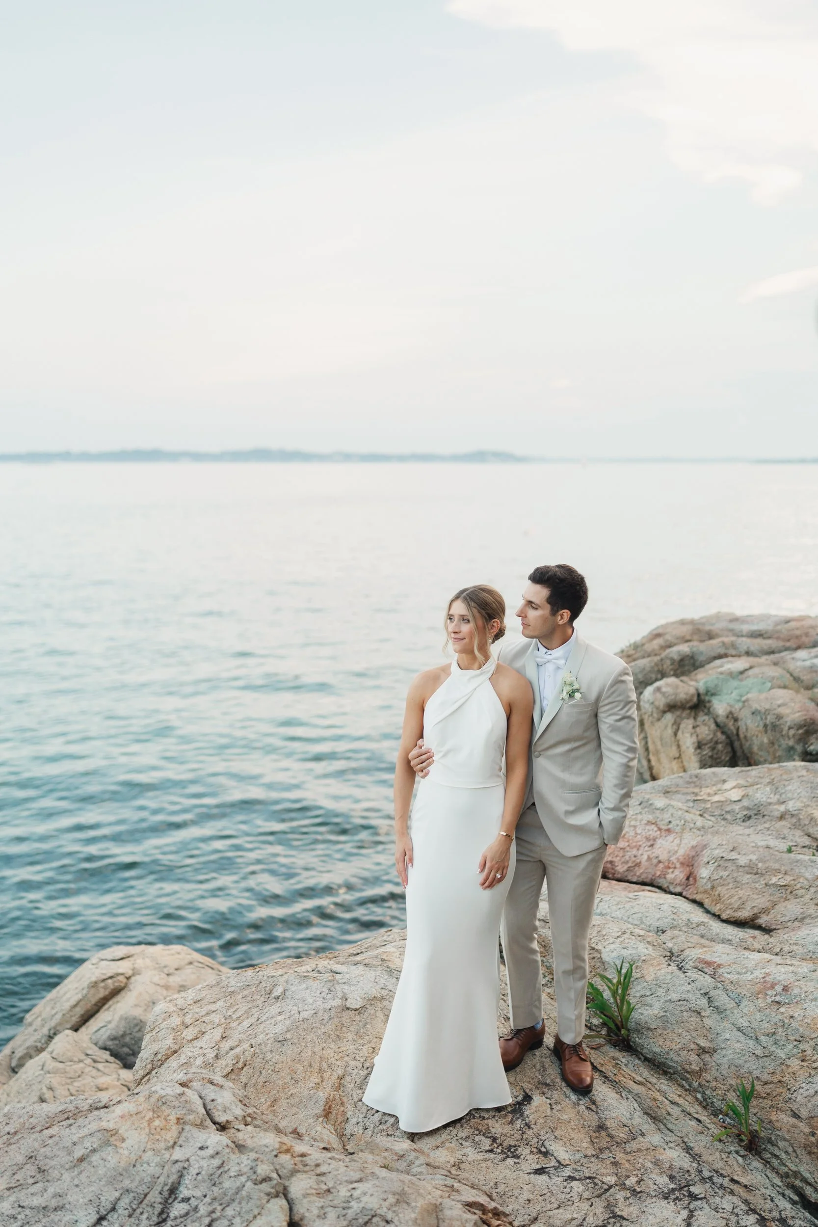 Romantic waterfront portraits captured in warm evening light.