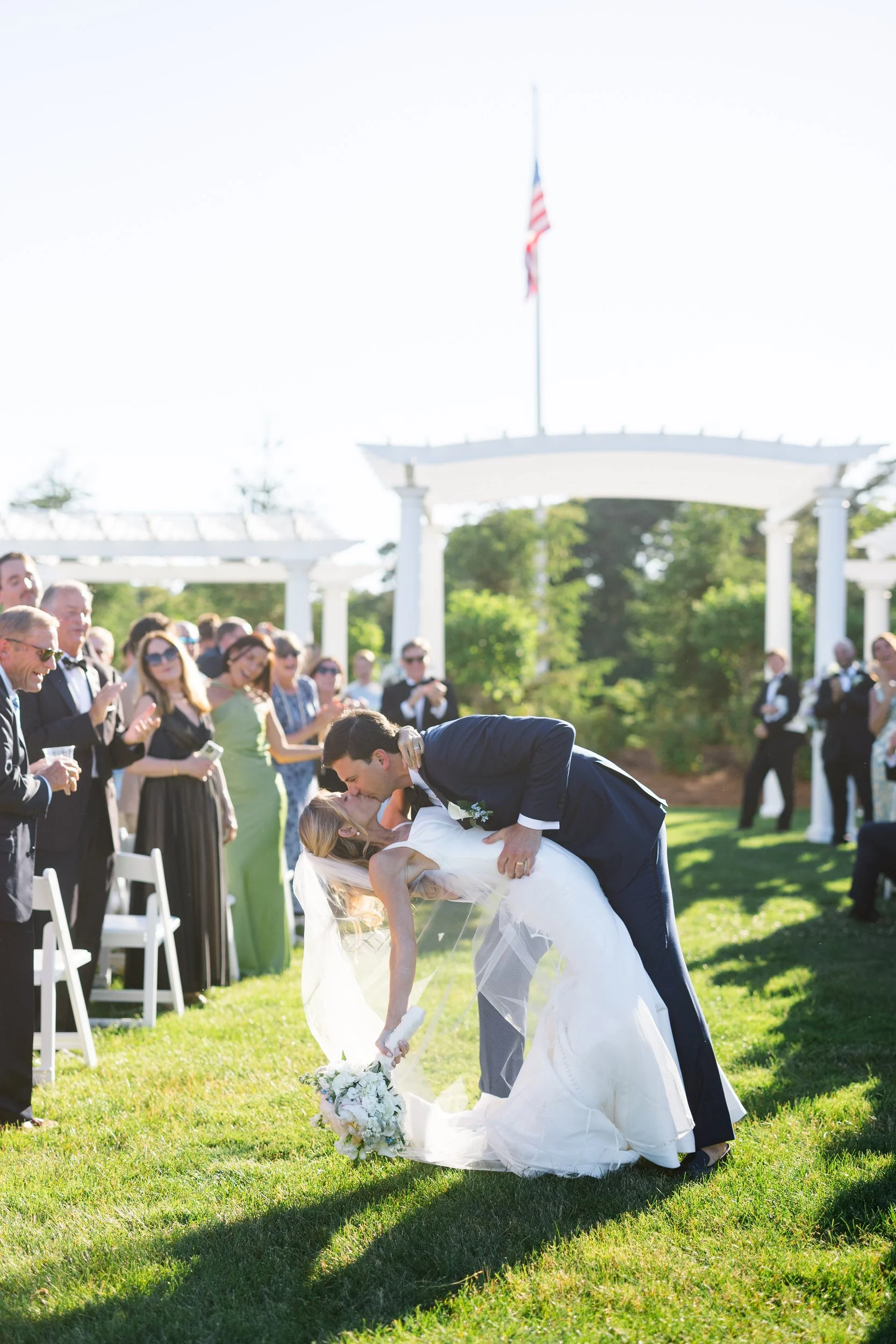 First kiss during a Cape Cod wedding ceremony
