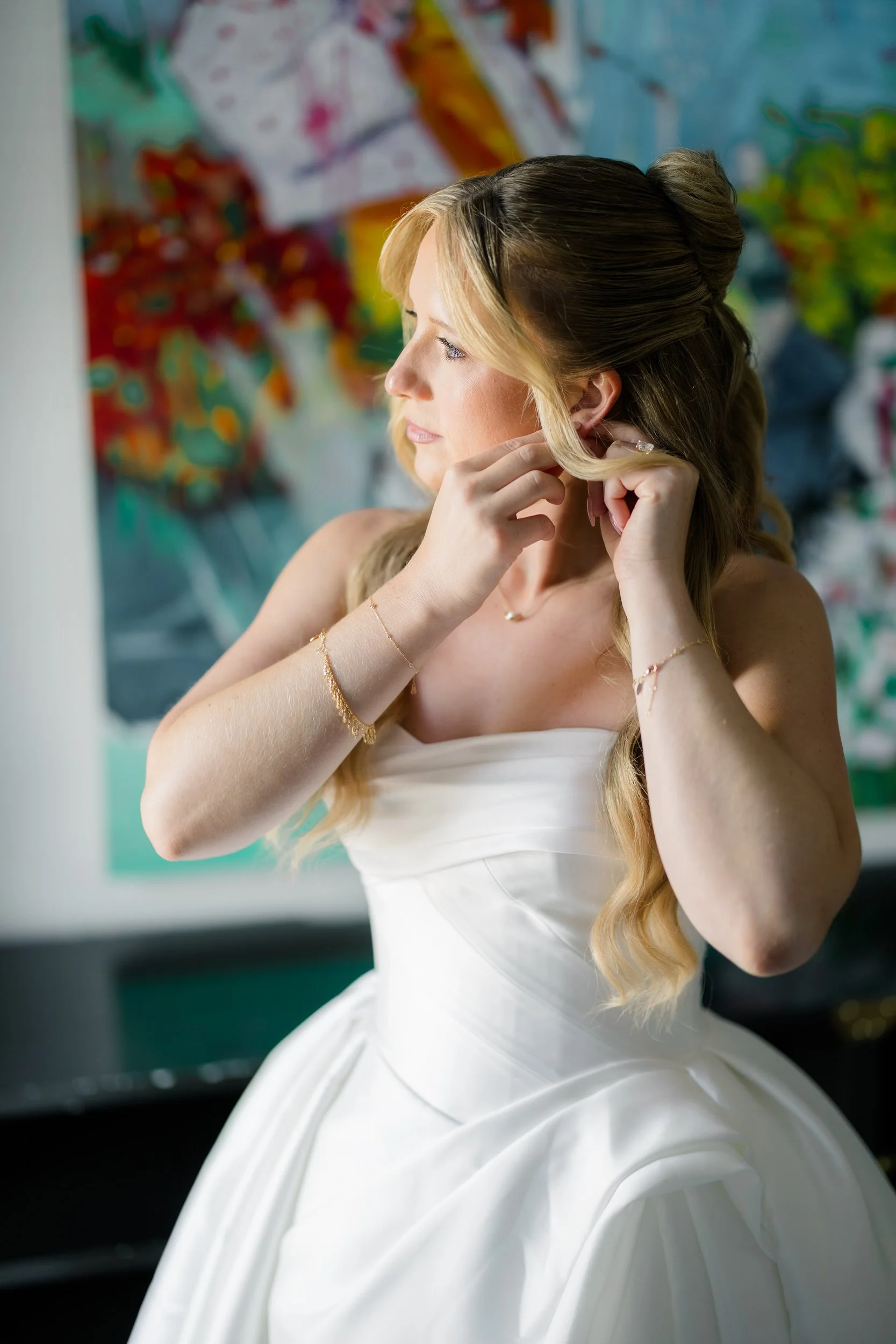 Bride getting ready in her suite at Hotel Commonwealth before her Elm Bank wedding