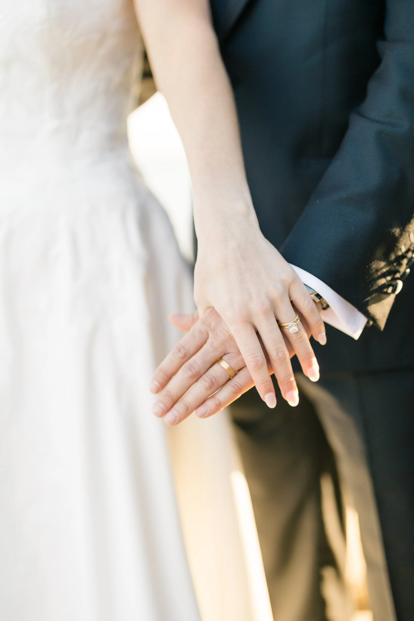Romantic golden hour wedding portraits on the rocky coastline at Misselwood Estate