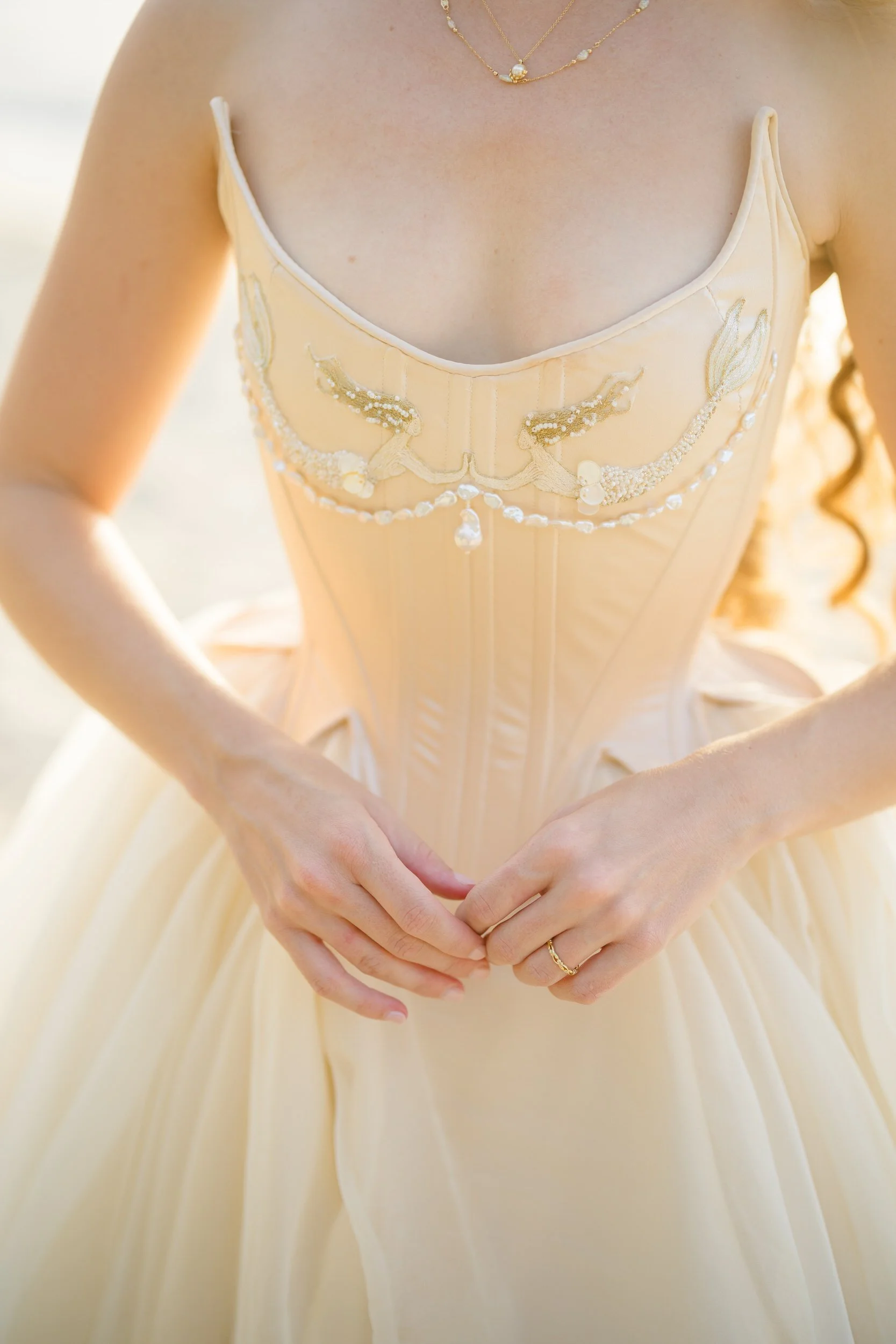 Handmade wedding dress details inspired by mermaids and the movement of the sea.