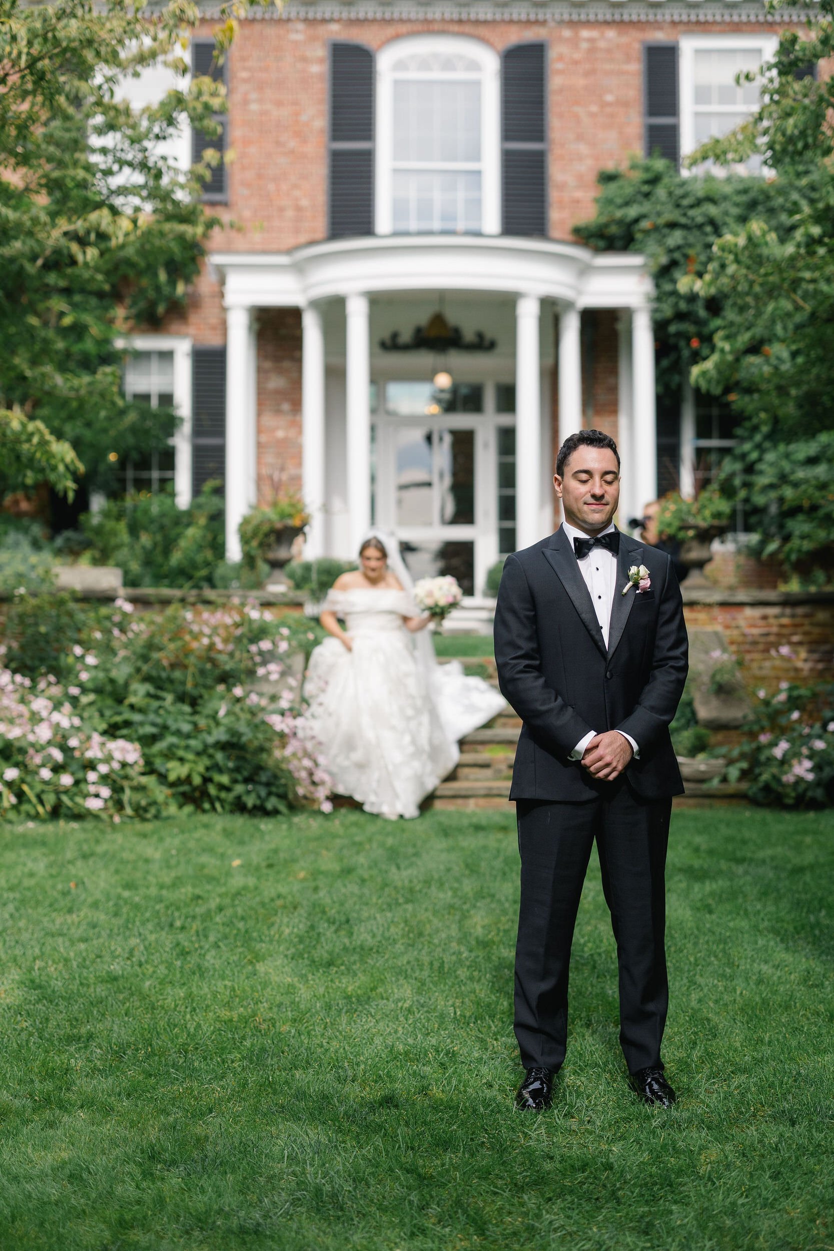 Emotional first look between newlyweds-to-be at the Long Hill garden wedding venue.