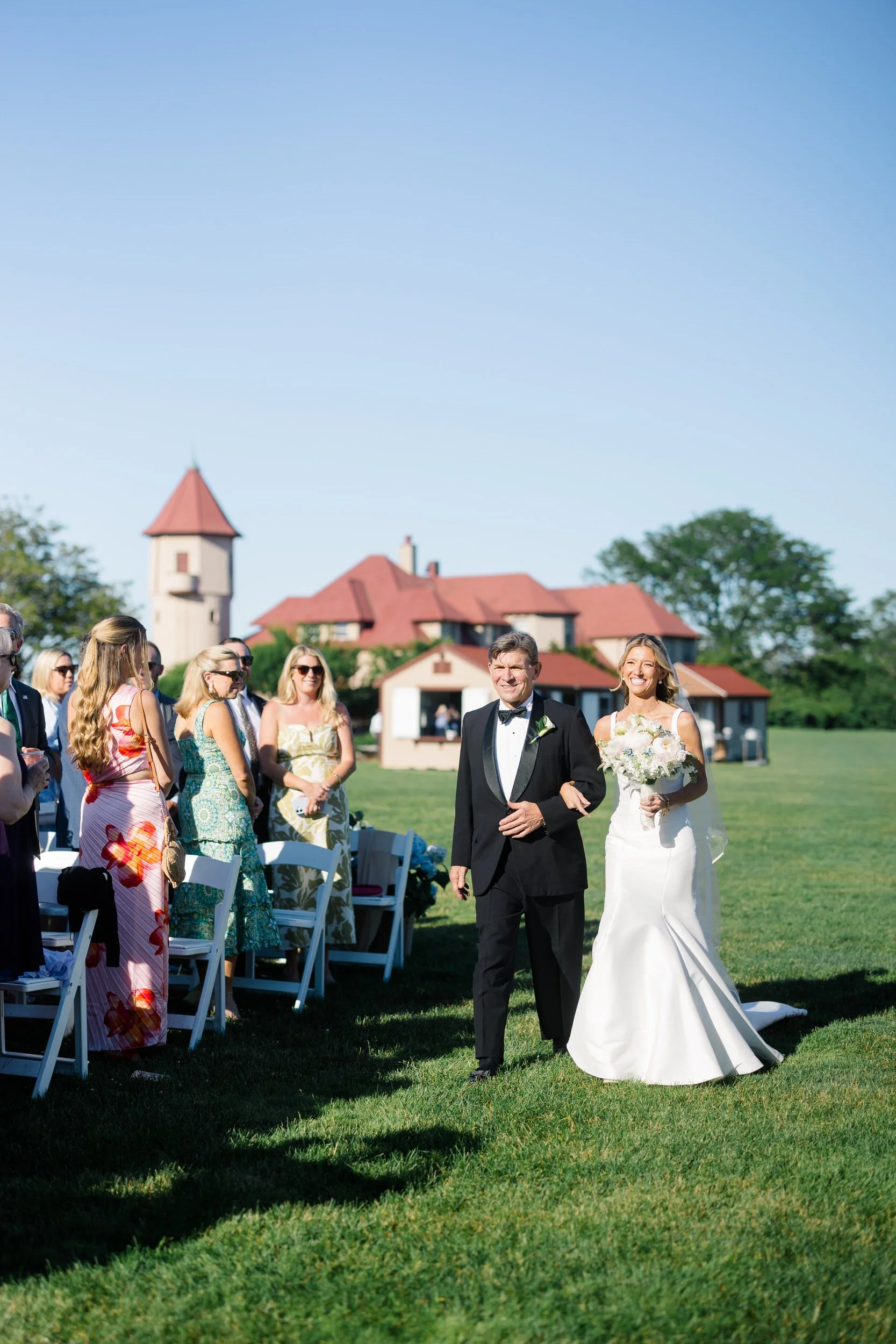 Bride walking down the aisle at Ocean Edge Resort wedding