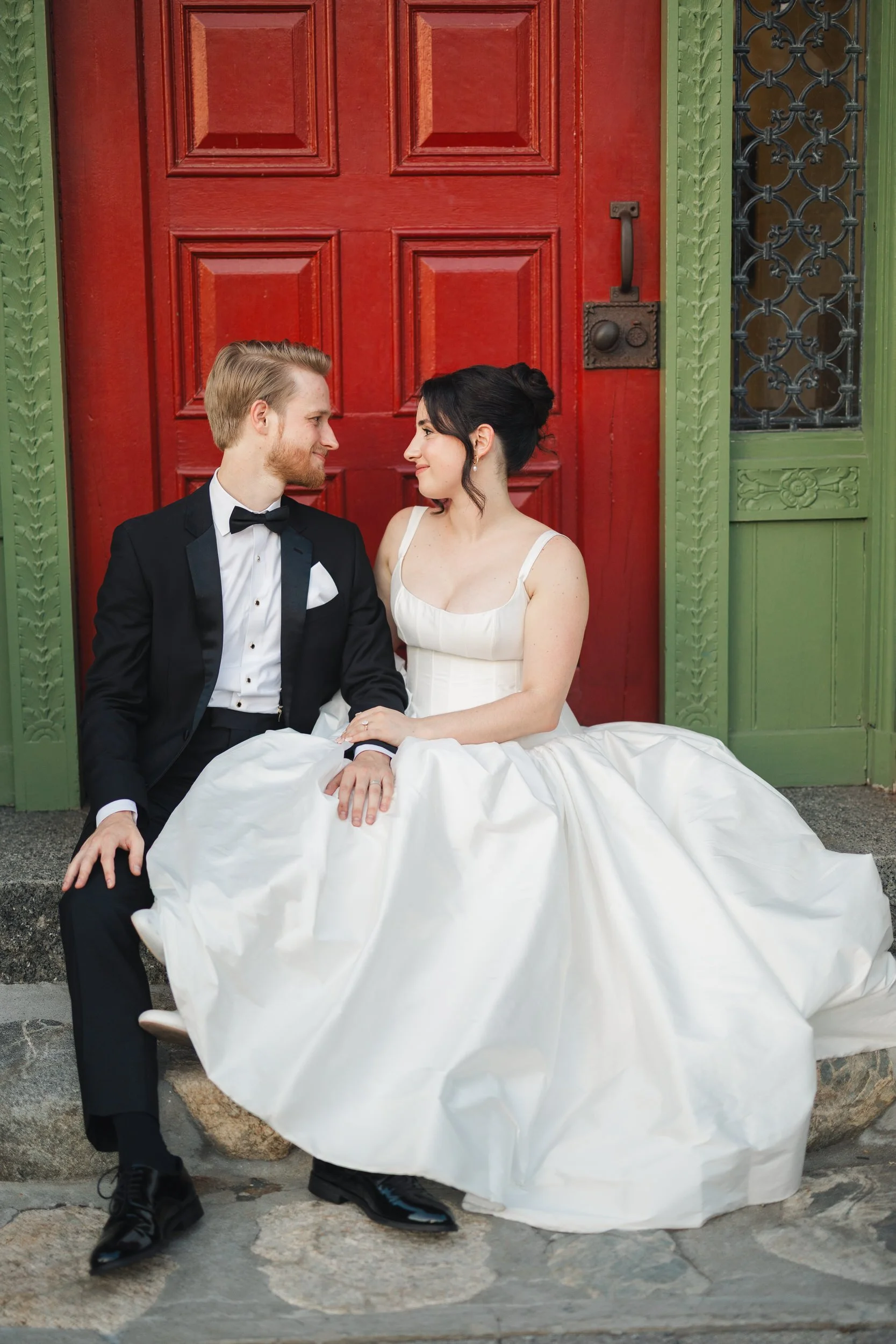 Editorial sunset portraits featuring basque waist gown and black tuxedo at Willowdale Estate
