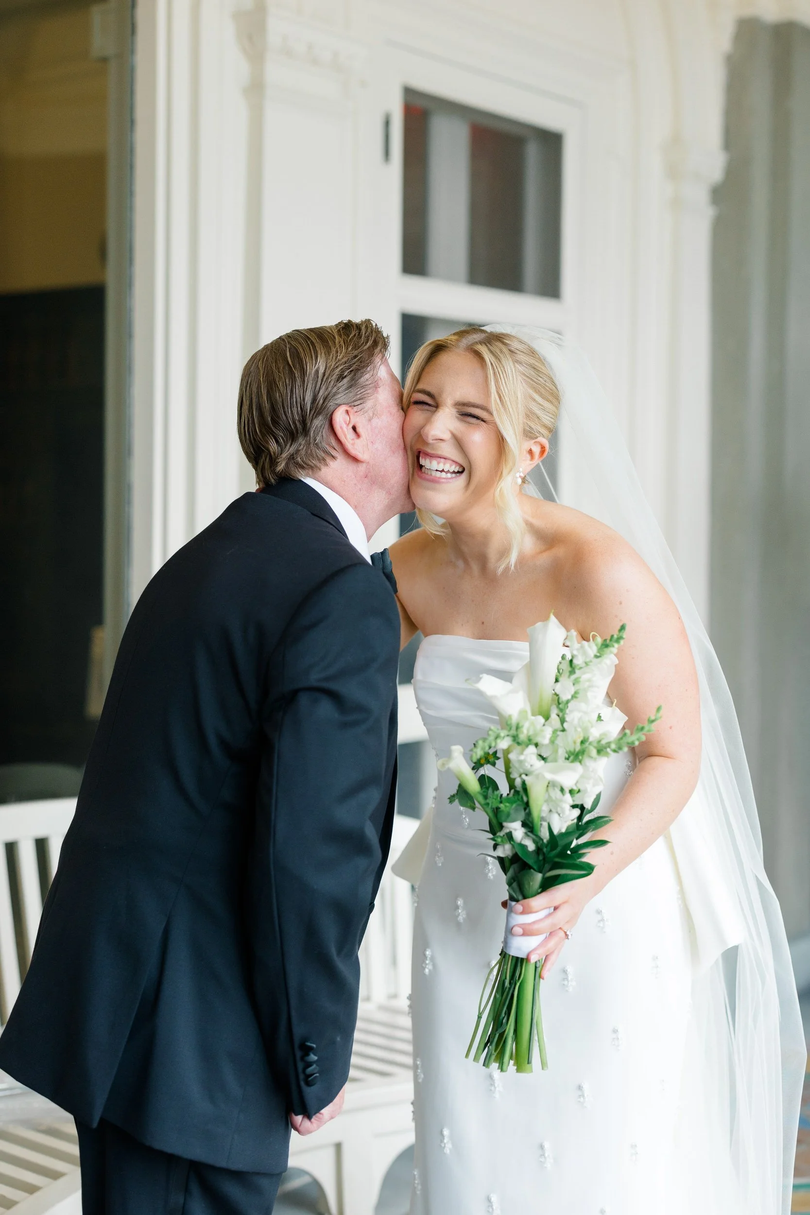Documentary photograph of a bride and her father's first look before their Blithewold Wedding.