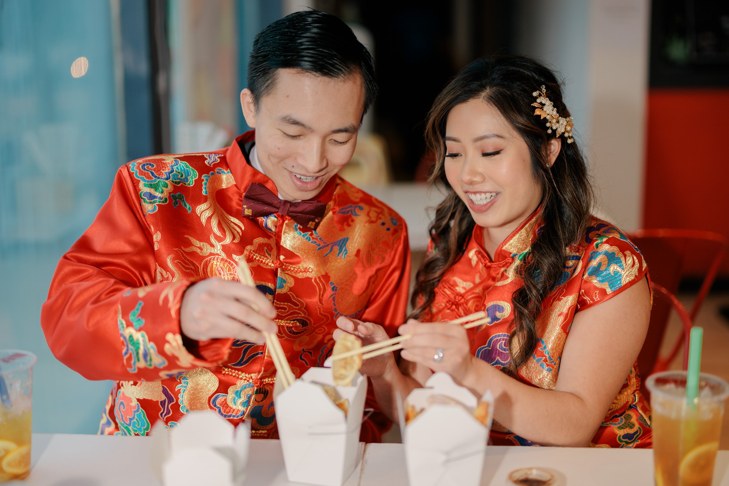 Bride and groom eat takeout before their Traditional Chinese Tea Ceremony Wedding in Boston, MA