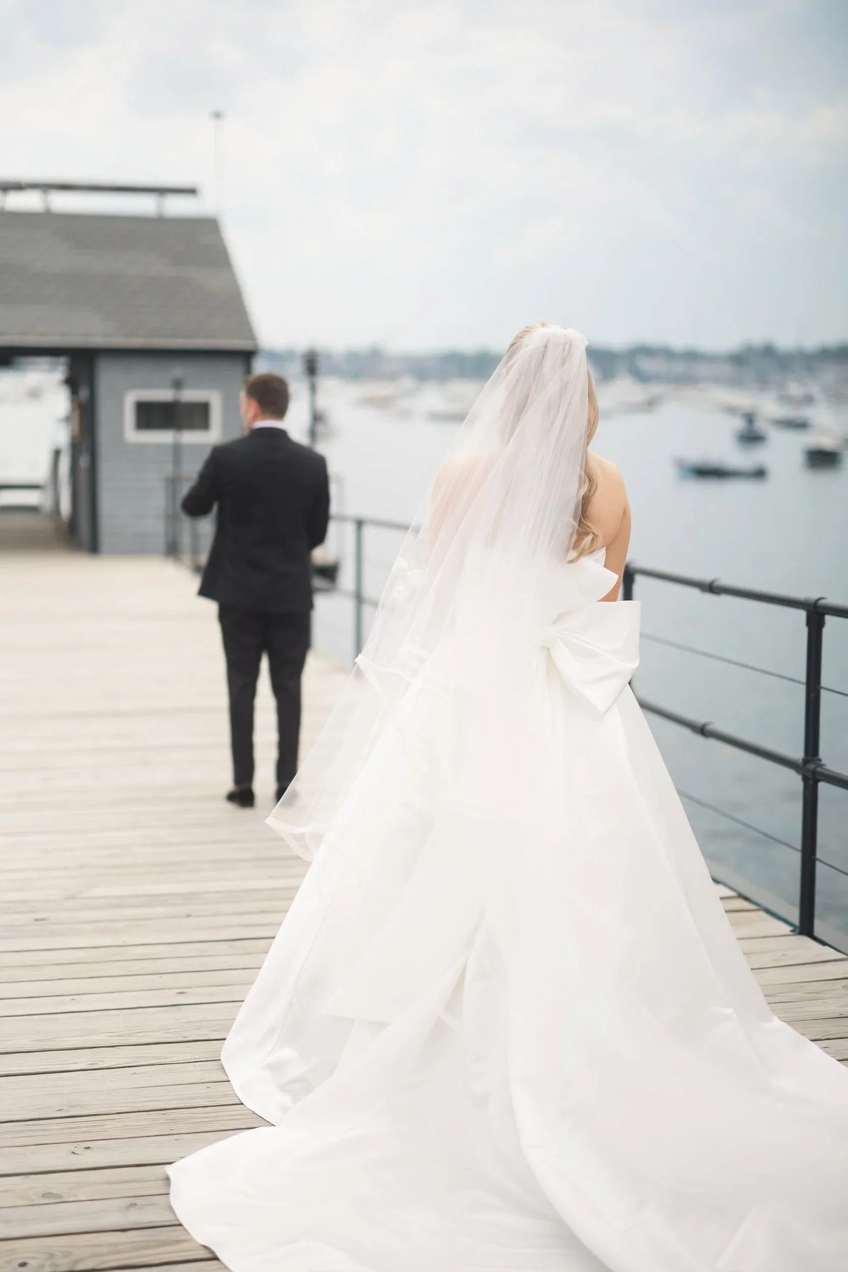 The couple’s emotional first look moment during their Marblehead Massachusetts waterfront wedding.