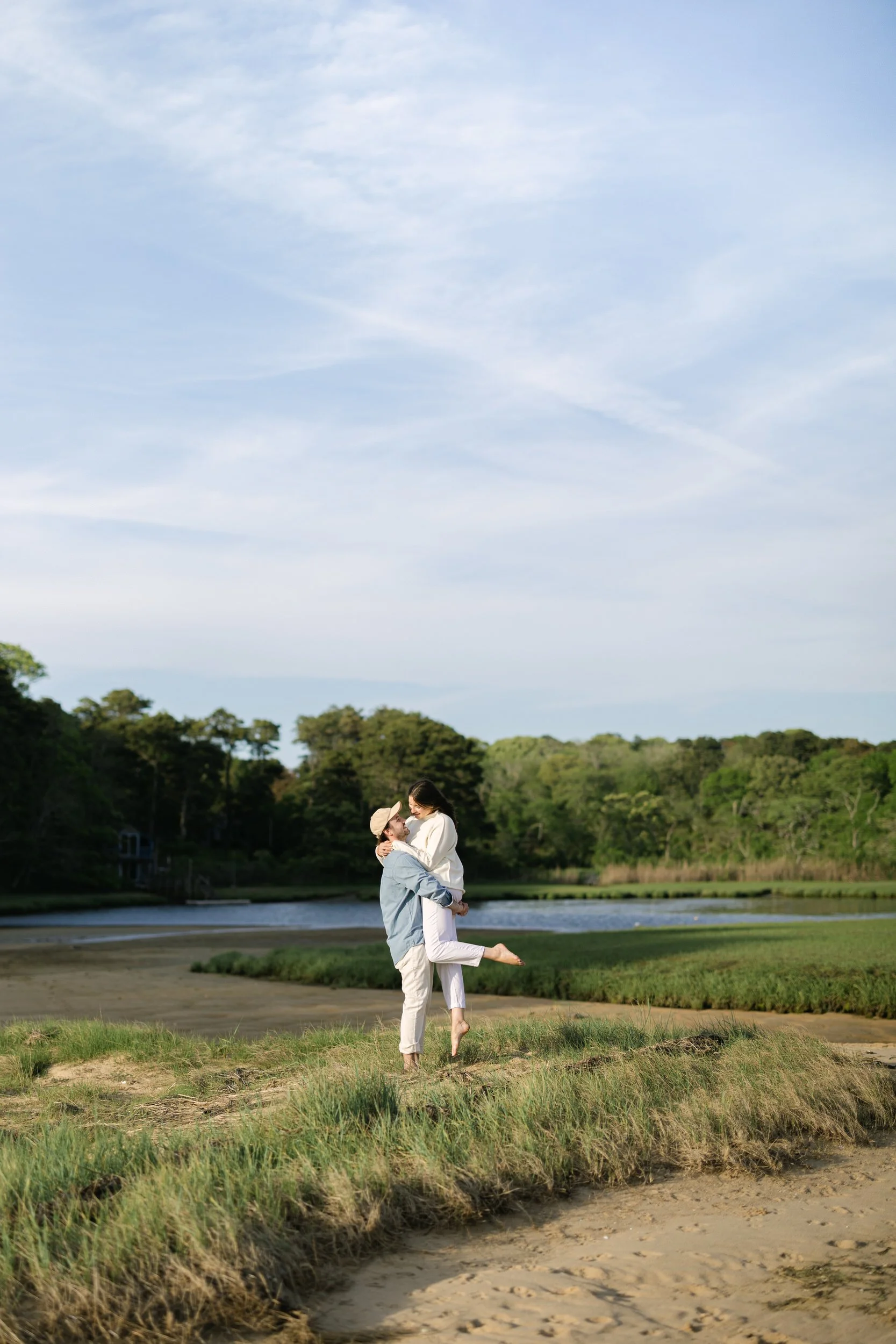 Cape Cod engagement session in Chatham featuring a beach portrait with dune grass and coastal wind.