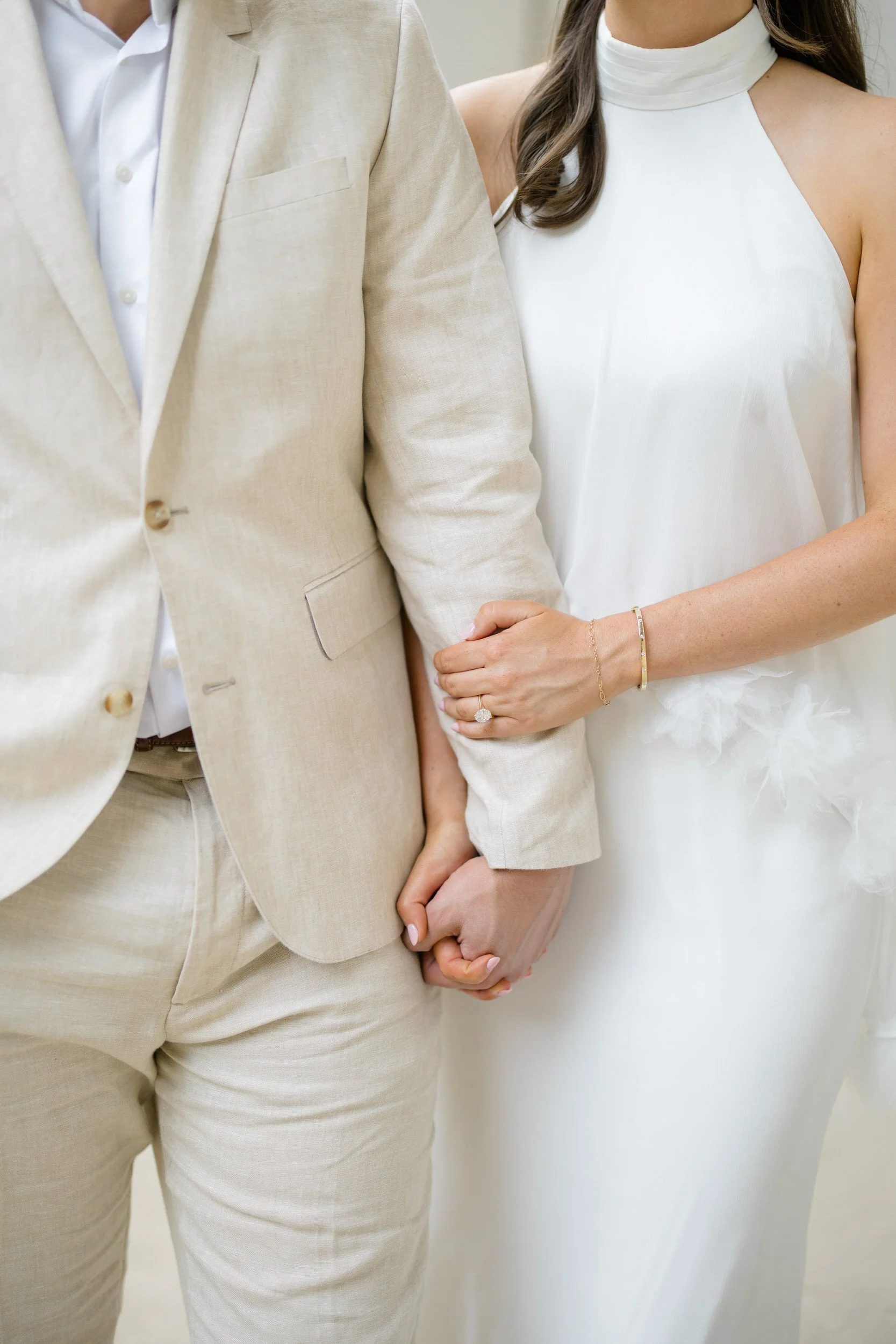 Timeless Cambridge engagement photos surrounded by marble columns and stone architecture.