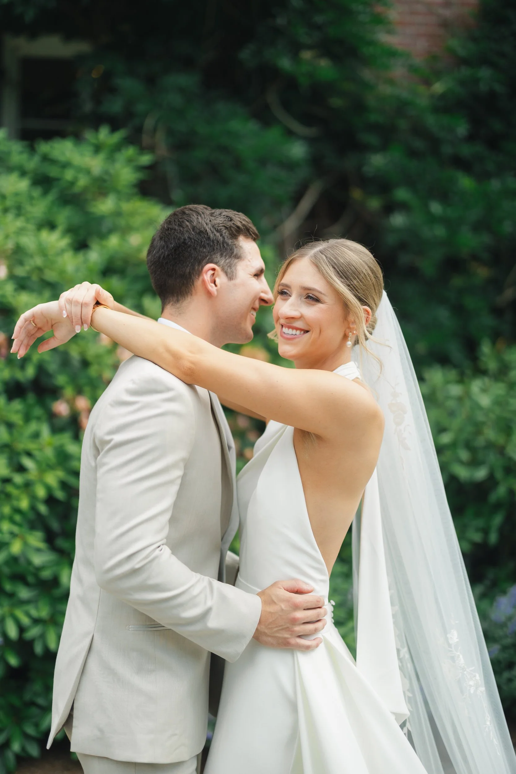 Elegant couple portraits at a coastal garden party wedding.