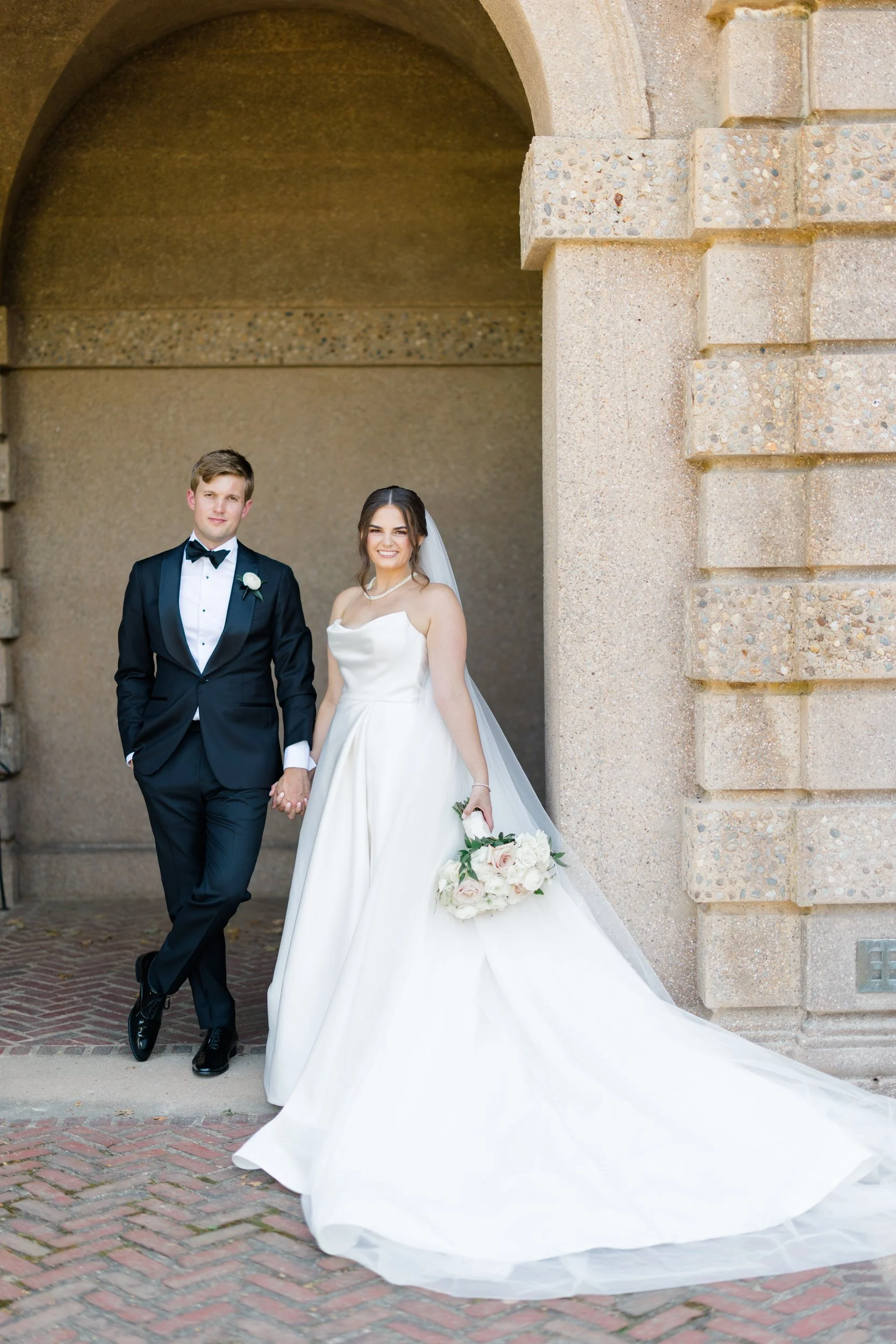 Editorial portraits of the couple in front of the historic Great House at Castle Hill on the Crane Estate.