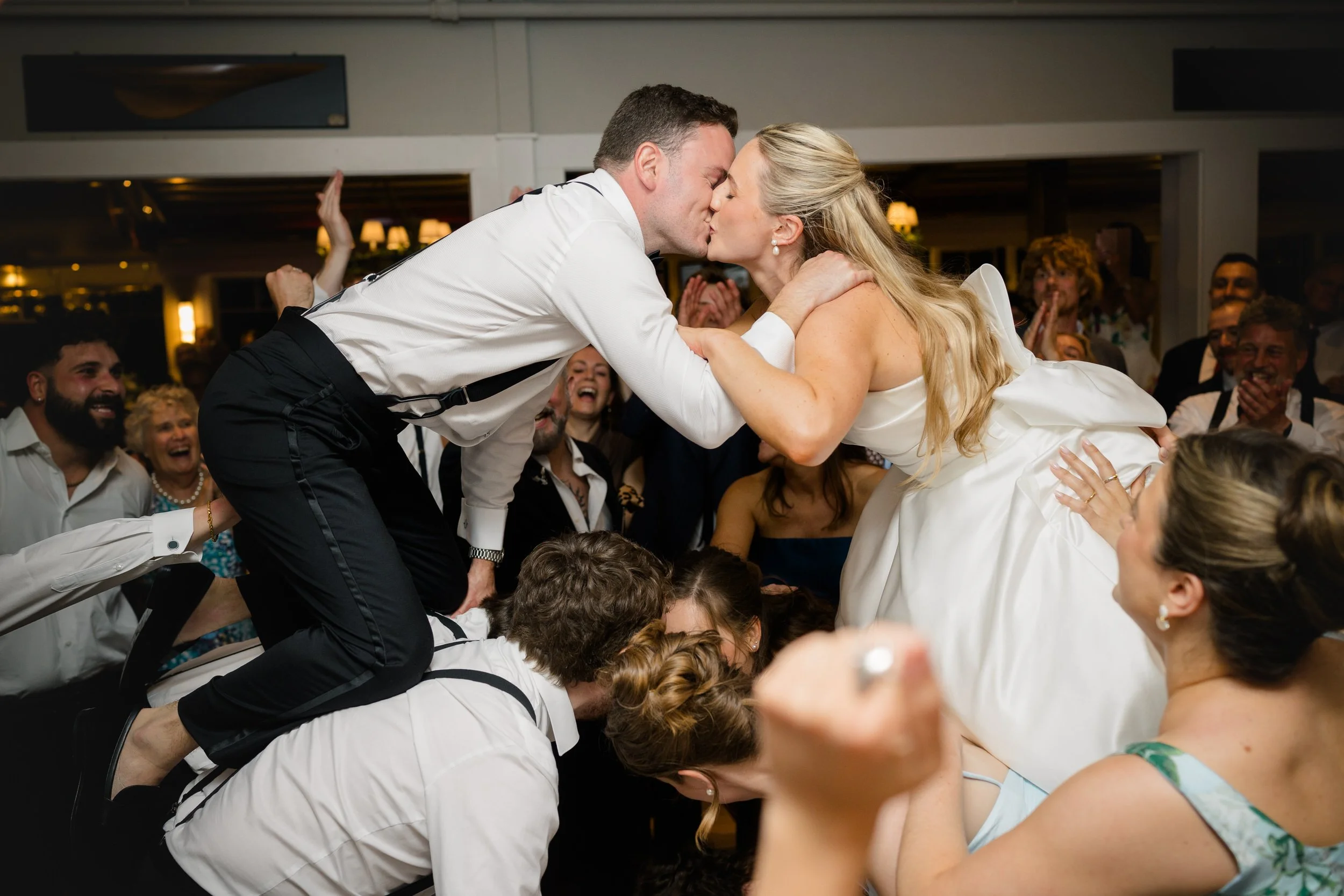 Packed dance floor during a Corinthian Yacht Club wedding celebration.
