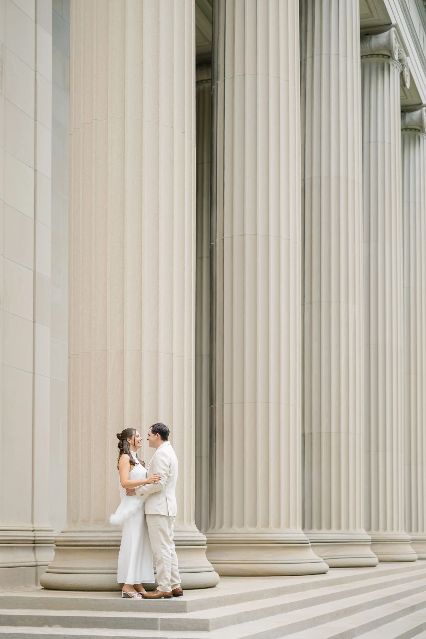 Romantic engagement session showcasing Cambridge's grand architectural details.