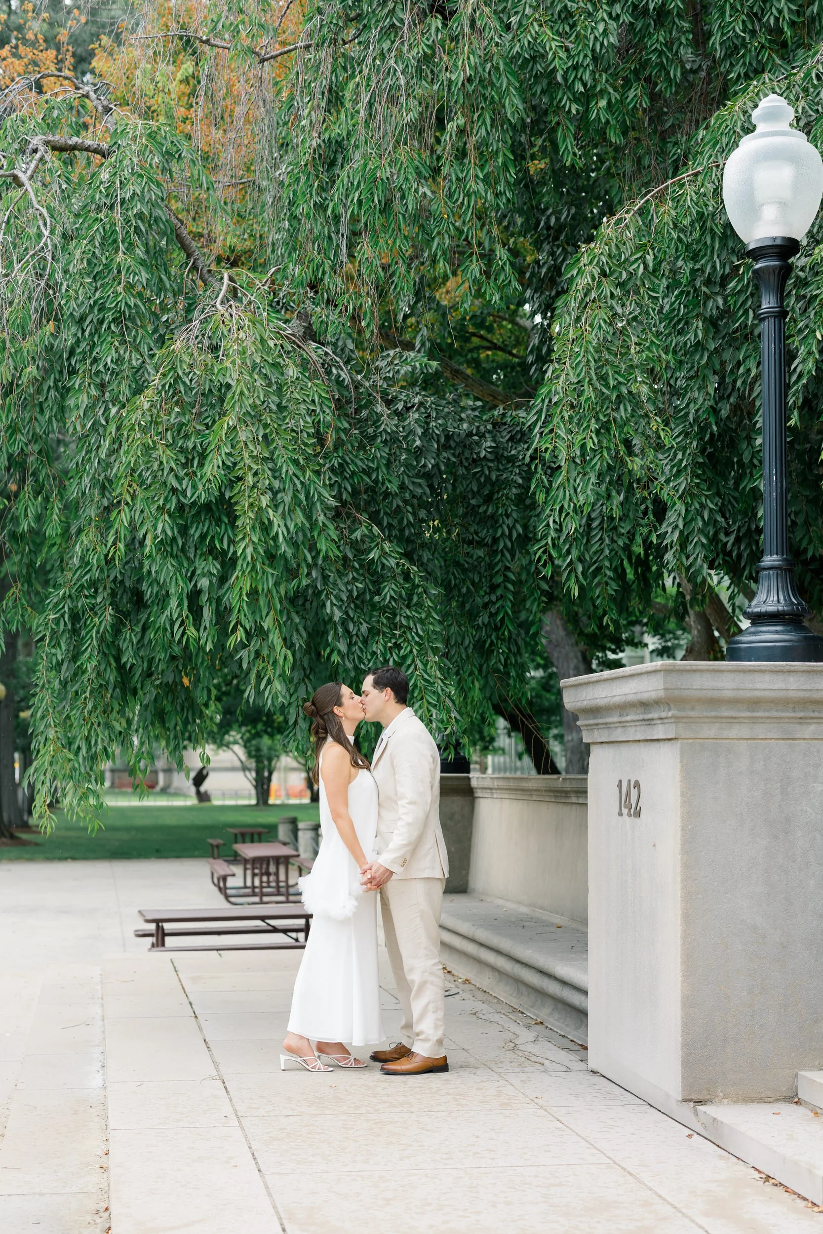 Architectural engagement portraits with marble columns in Cambridge.