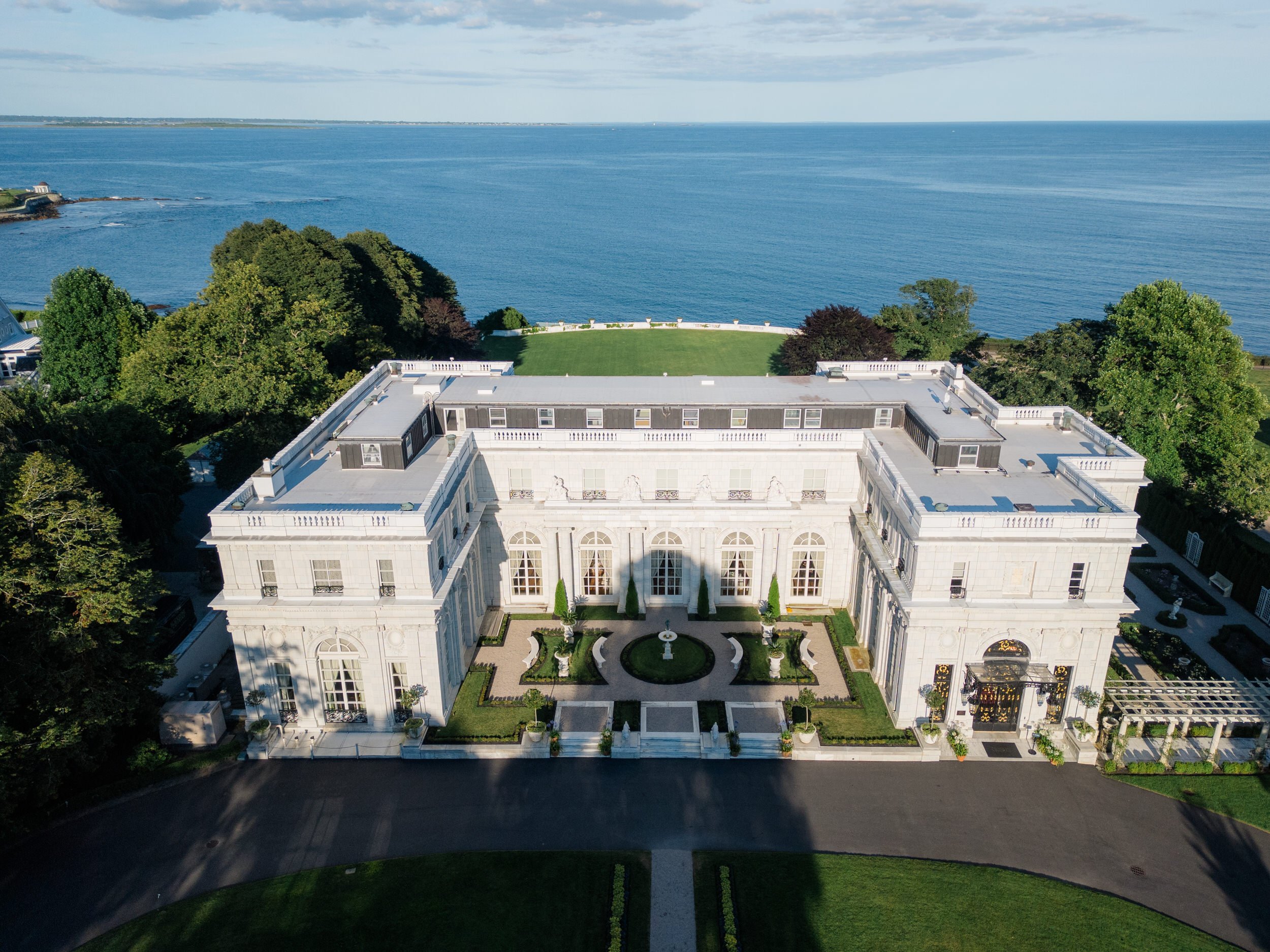 Scenic exterior of Rosecliff Mansion overlooking the Newport coastline