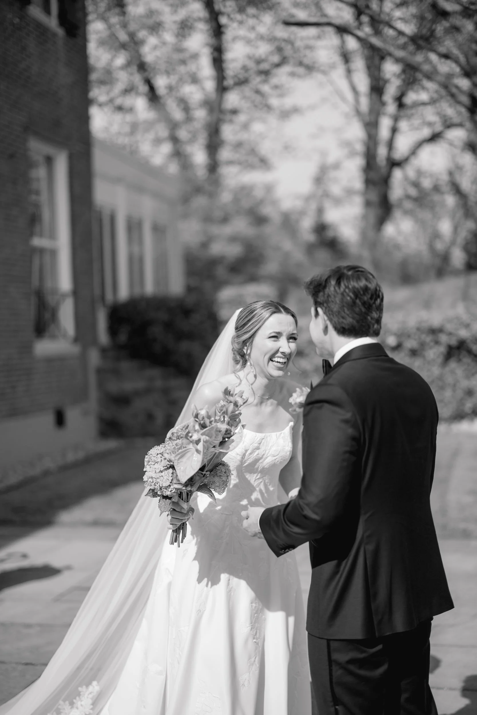 Modern coastal wedding first look with emotional candid moments