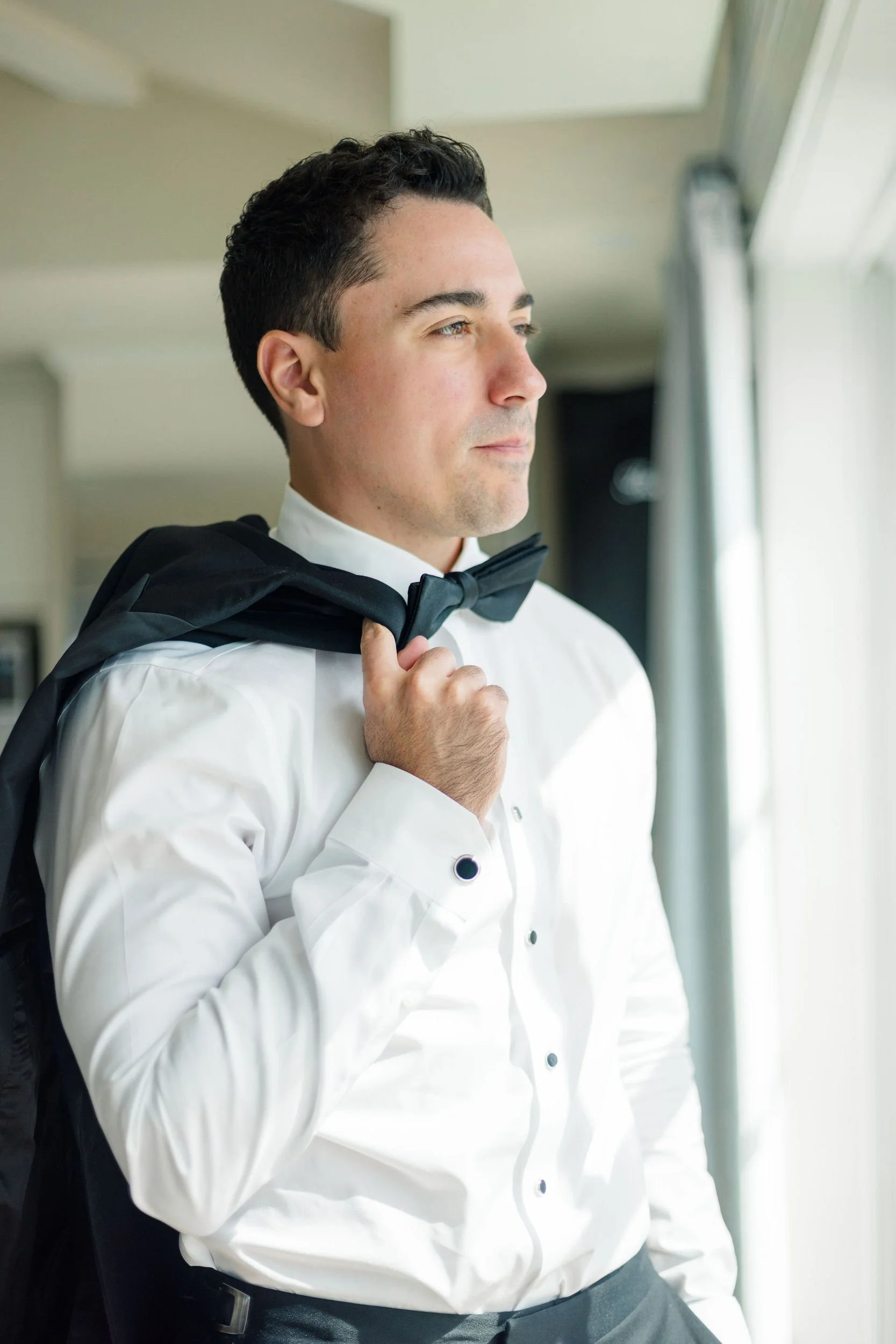 Groom getting ready for his wedding at Long Hill in Beverly, Massachusetts.