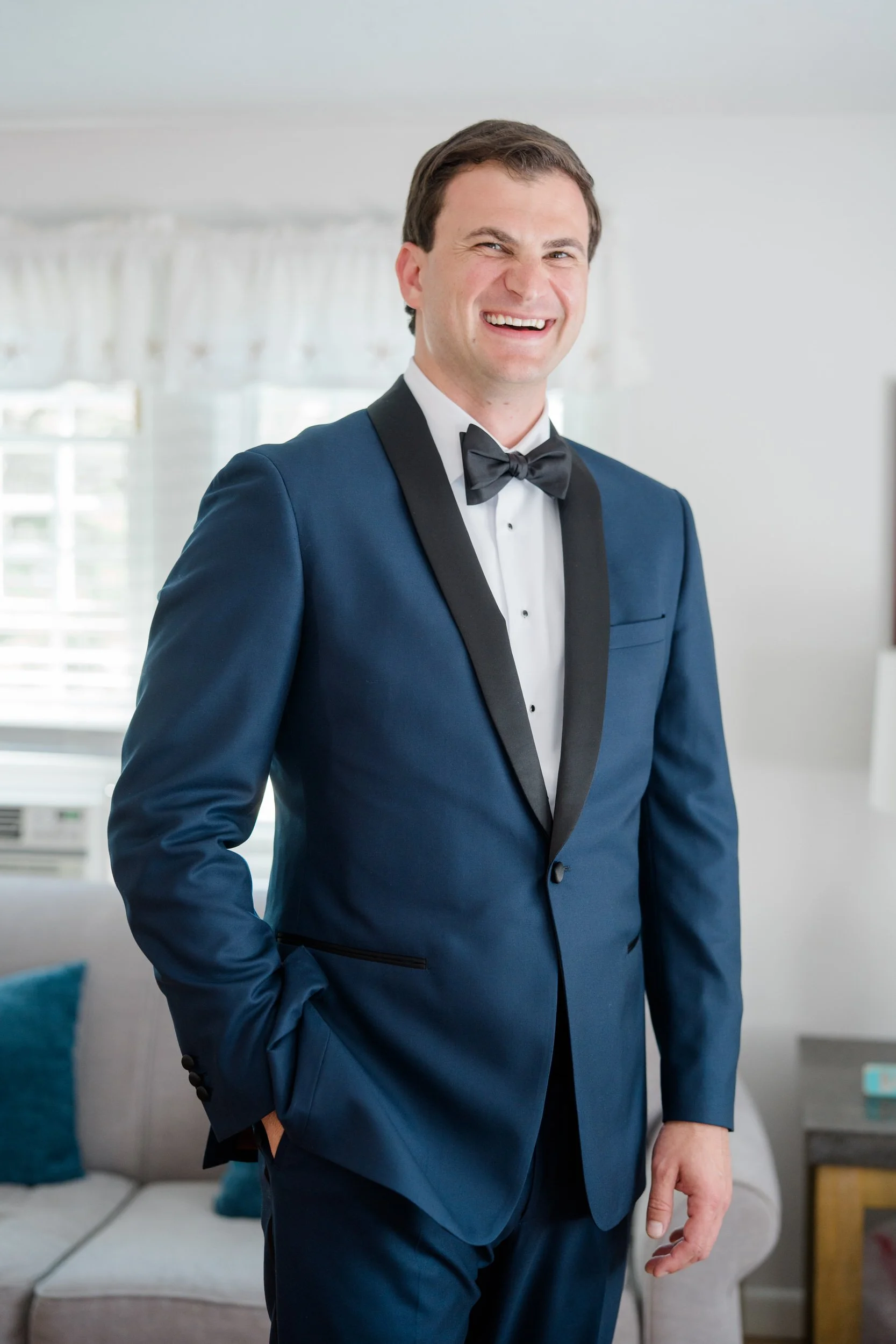 Groom getting ready with groomsmen before the wedding ceremony