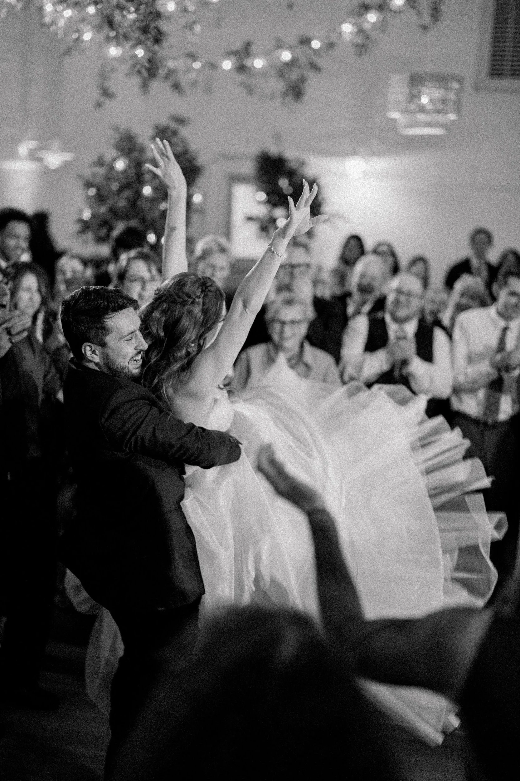 Candid photographs of guests dancing during a wedding reception at Elm Bank.