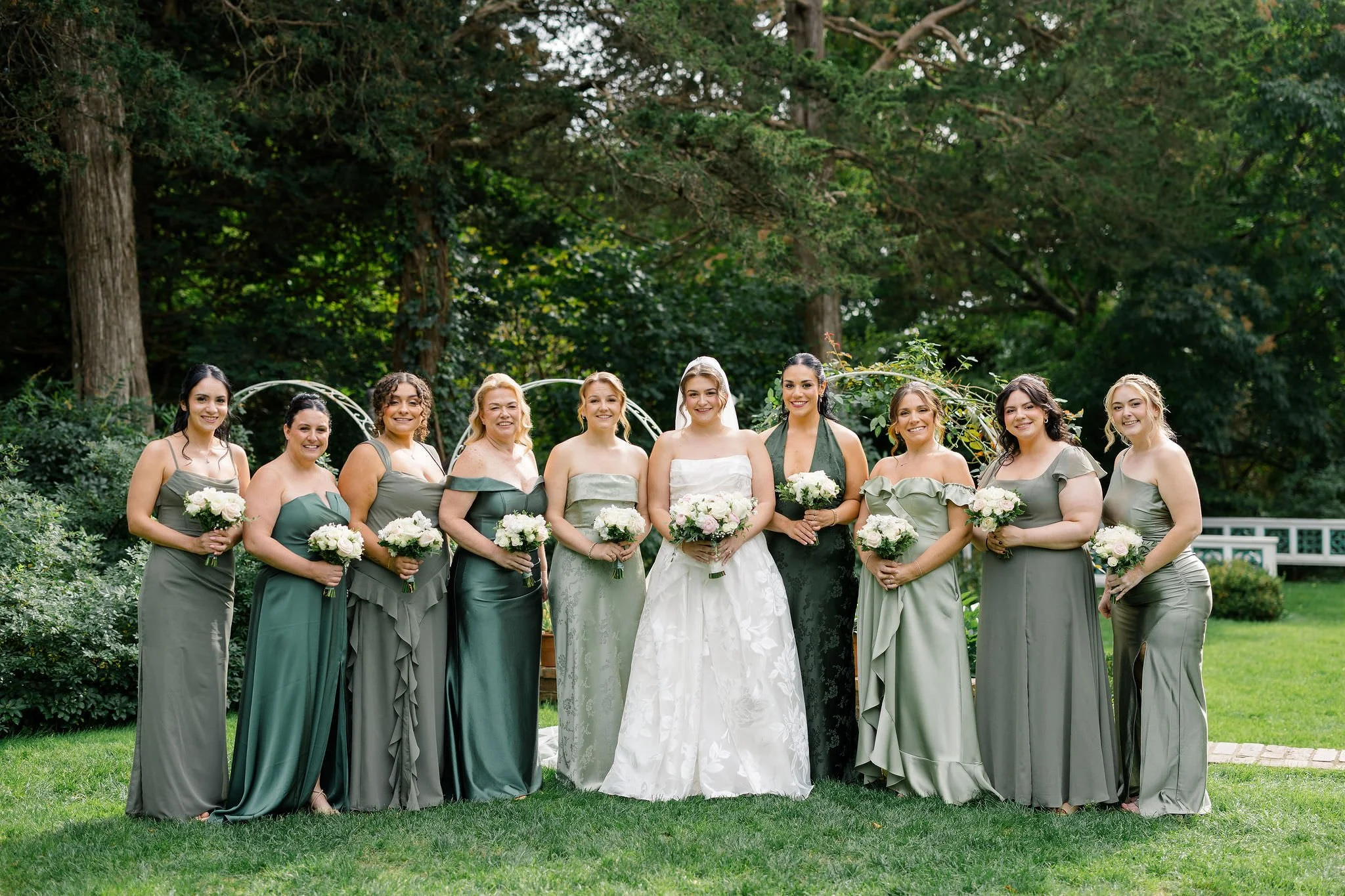 Bridesmaids photographed in the gardens at Long Hill in Beverly, Massachusetts.