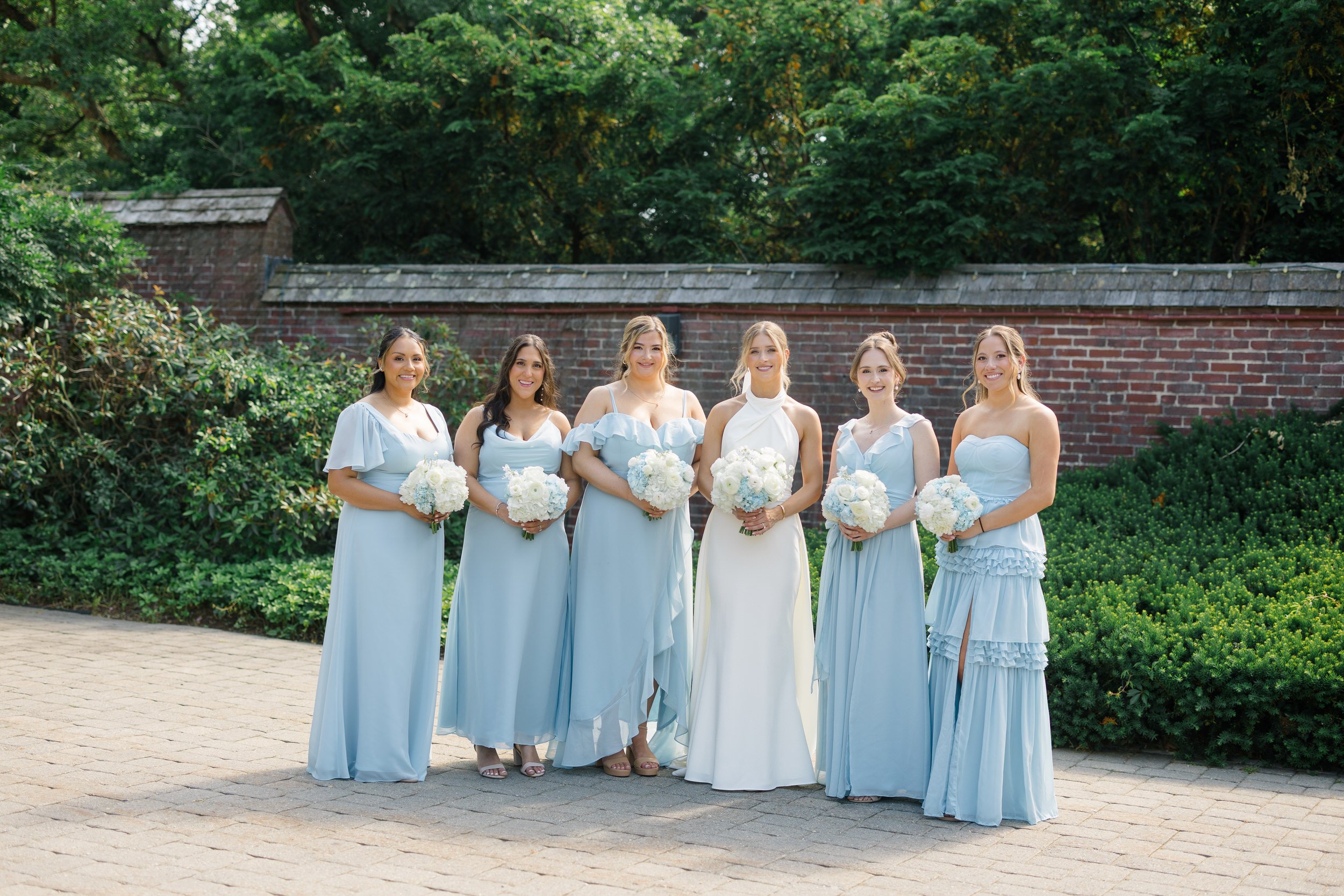 Bridal party celebrating together outside at Misselwood Estate.