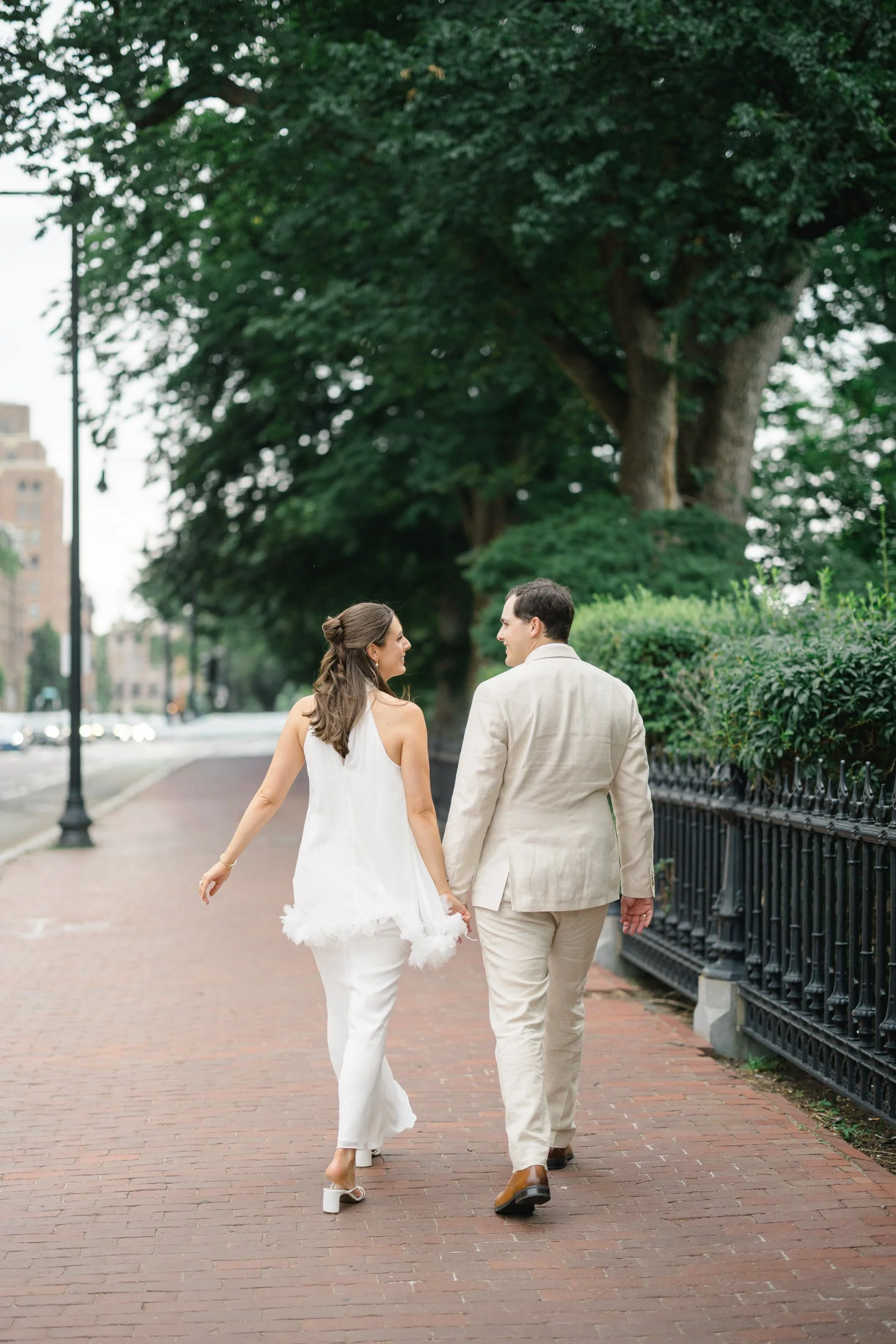 Couple strolling through Beacon Hill during a summer engagement session.