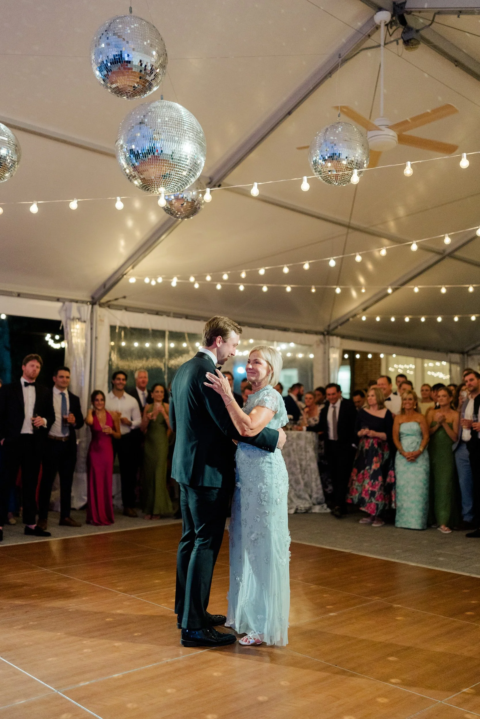 Friends and family dancing during an Italian garden wedding celebration