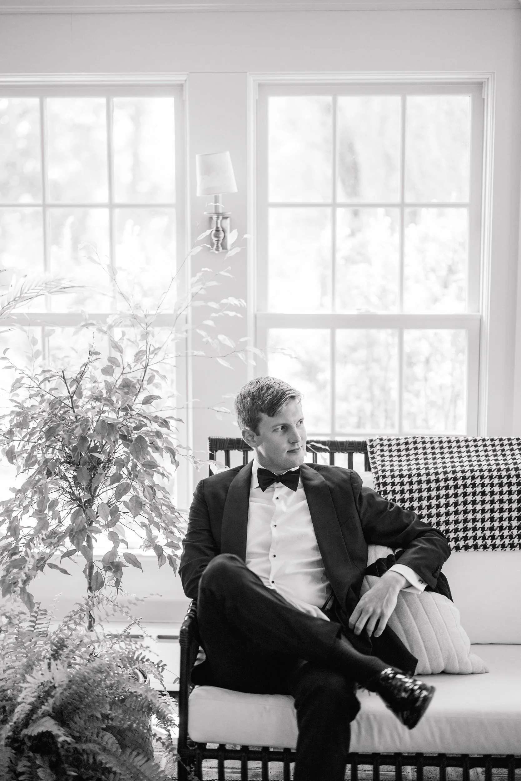 Groom preparing for his wedding morning at Cedarwood Farm with his groomsmen before heading to Crane Estate in Ipswich, Massachusetts.