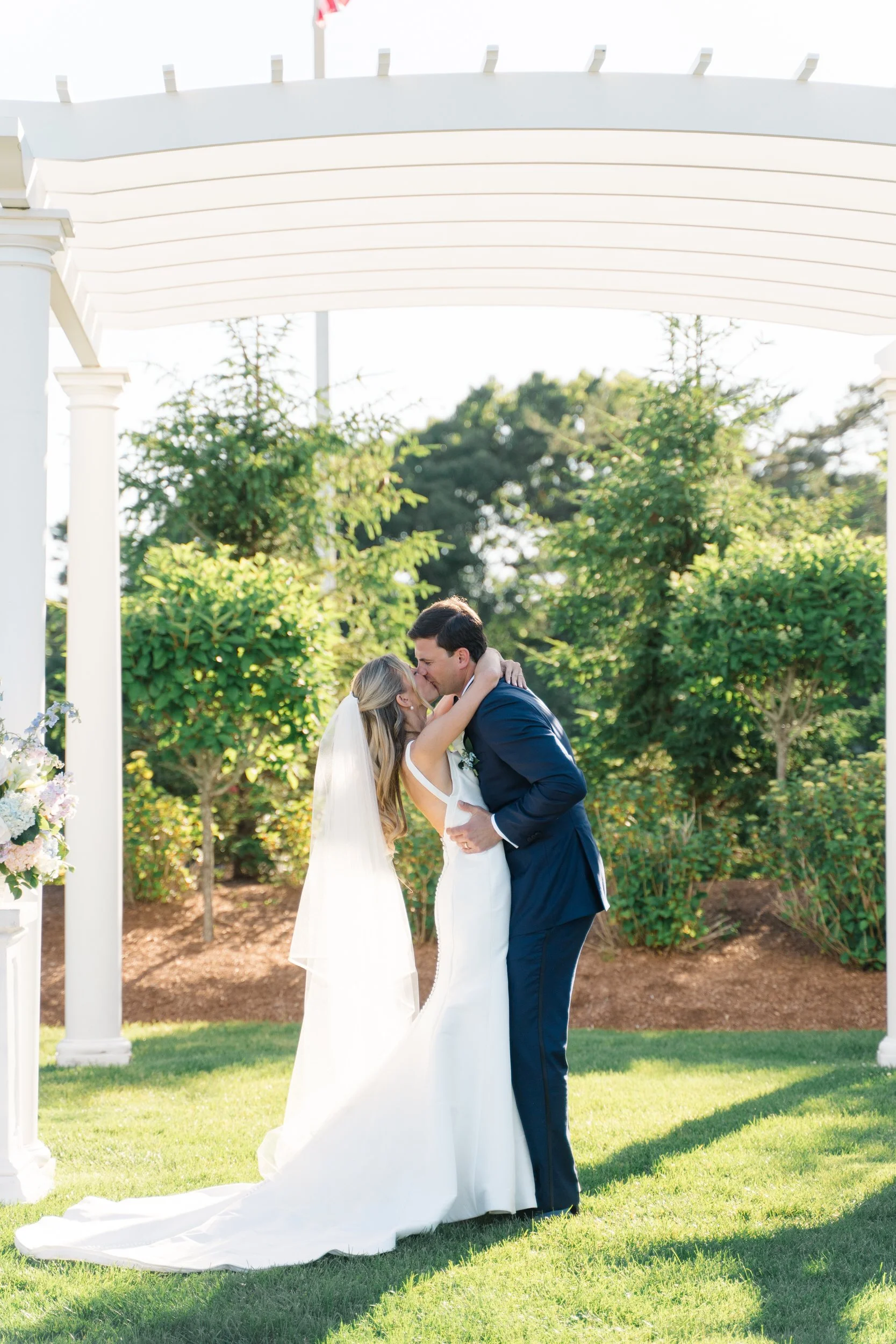 First kiss during a Cape Cod wedding ceremony