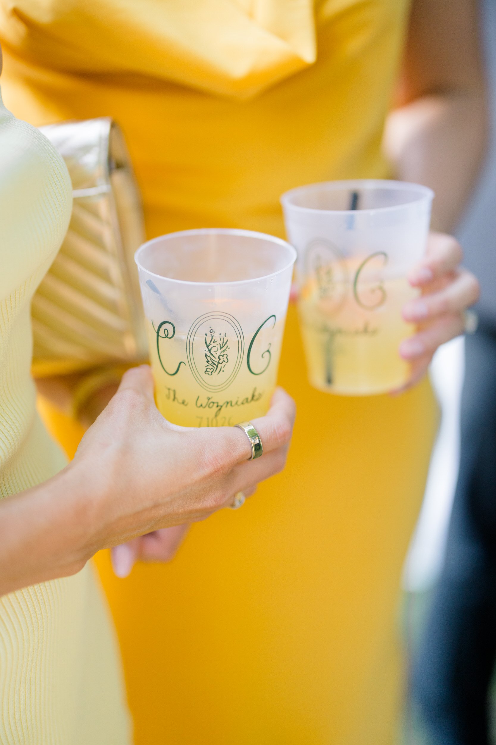 Custom monogrammed cups at a garden wedding cocktail hour