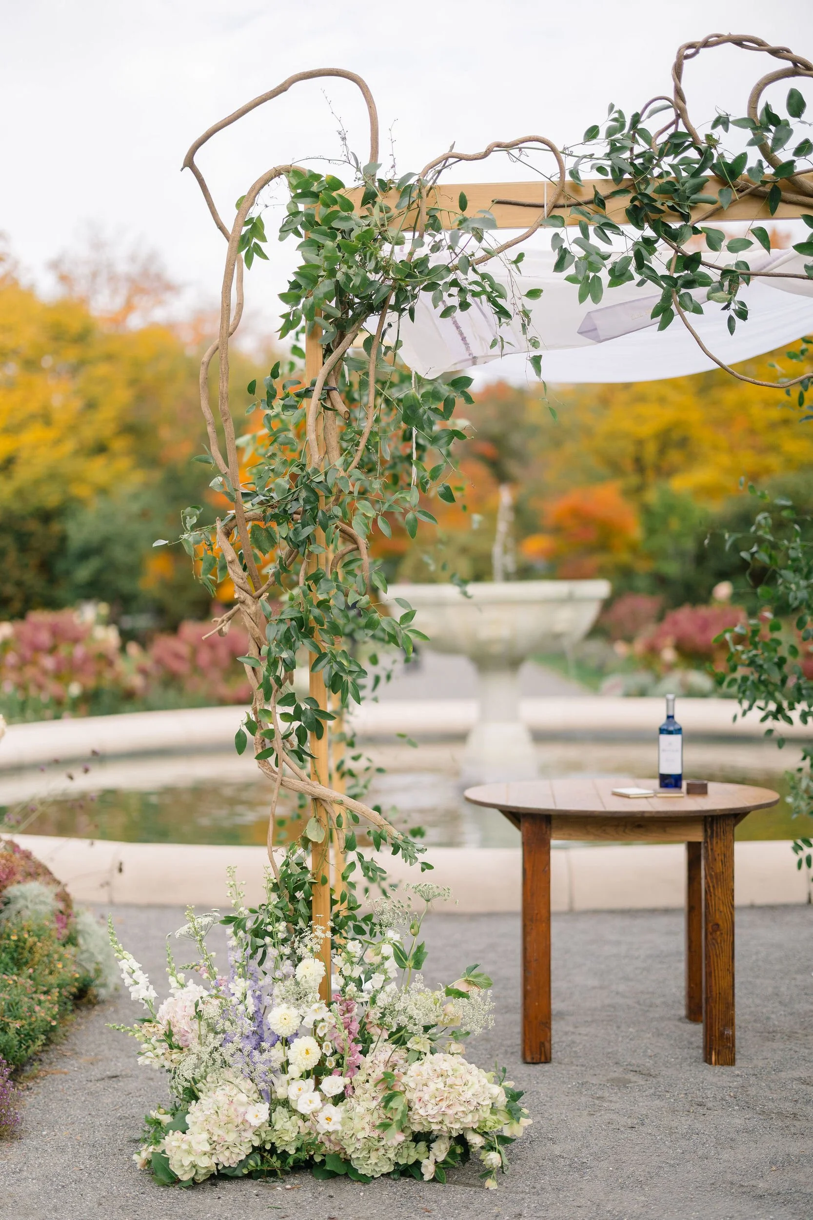 Garden inspired ceremony decor at an Elm Bank wedding in Wellesley, Massachusetts.