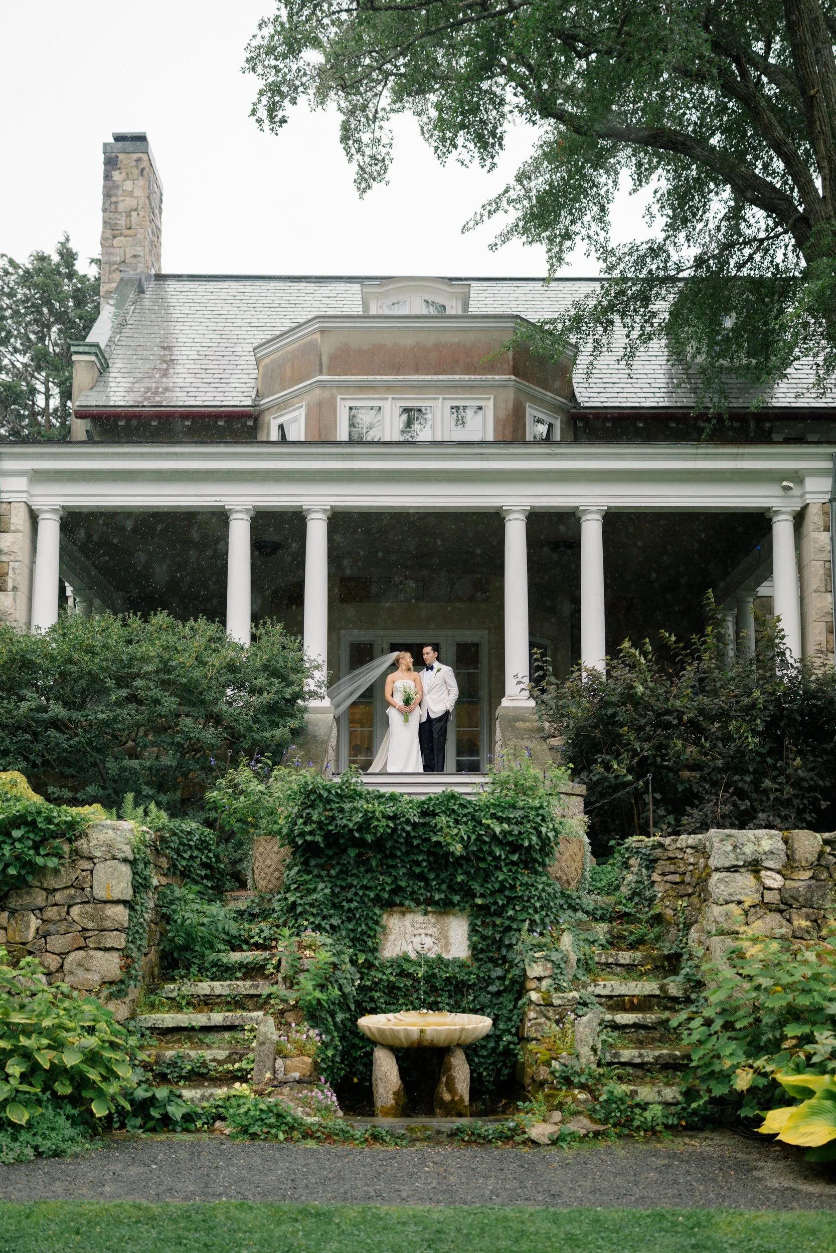 Romantic outdoor portraits at Blithewold Mansion & Gardens after a summer rain.