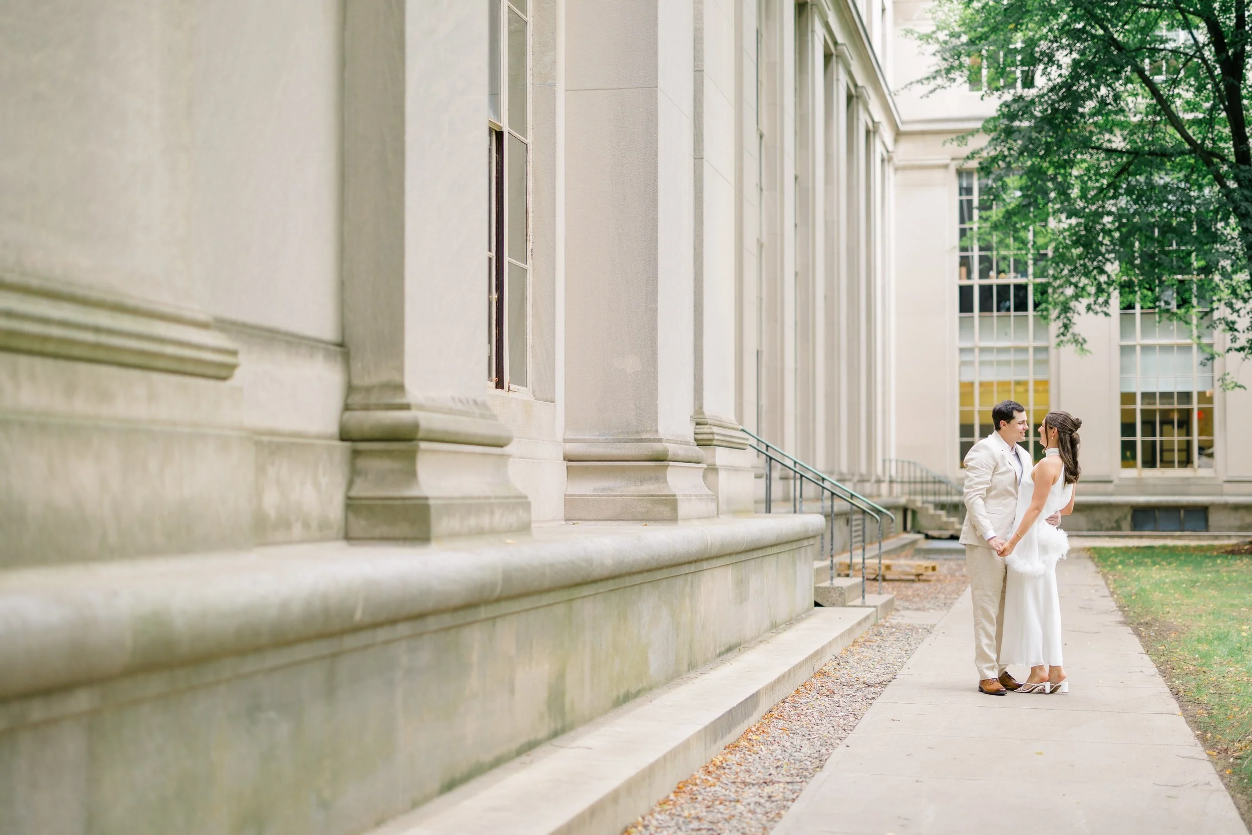 Editorial engagement portraits featuring Cambridge's elegant neoclassical architecture.