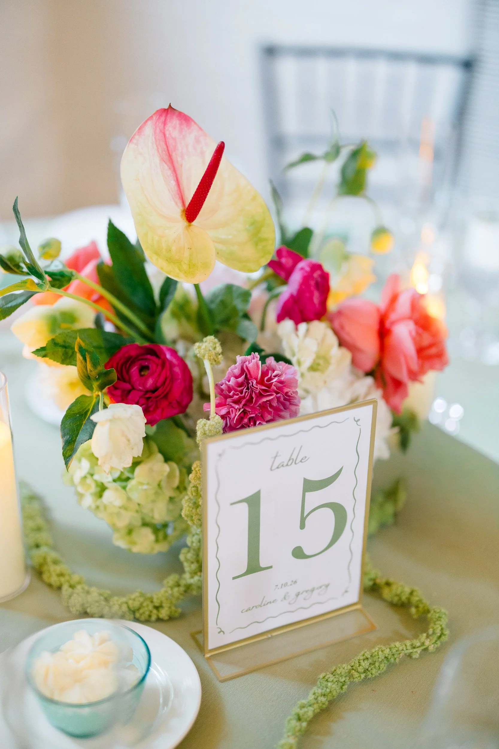 Floral reception details featuring pink and green wedding flowers