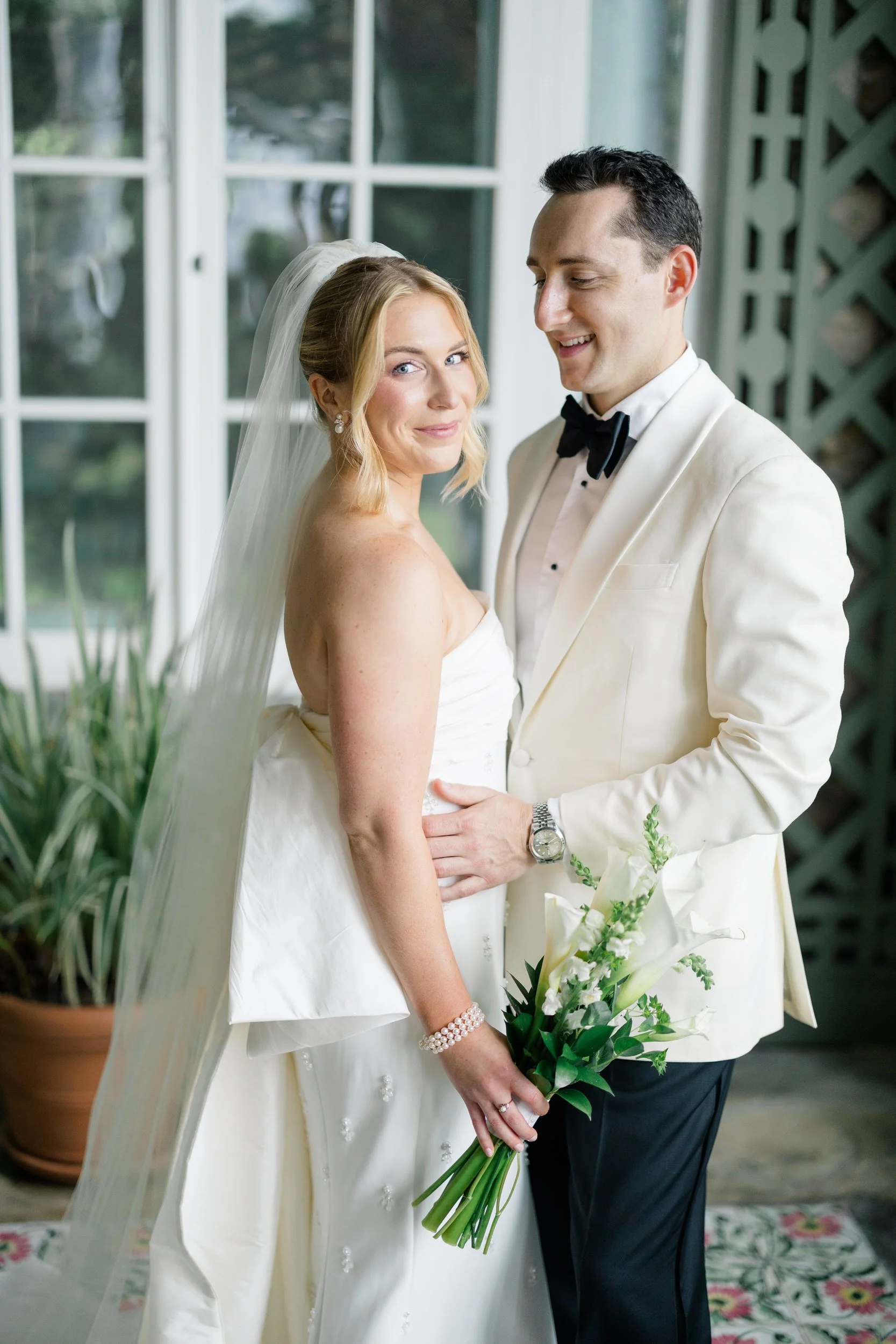 Editorial wedding portraits inside historic Blithewold Mansion.
