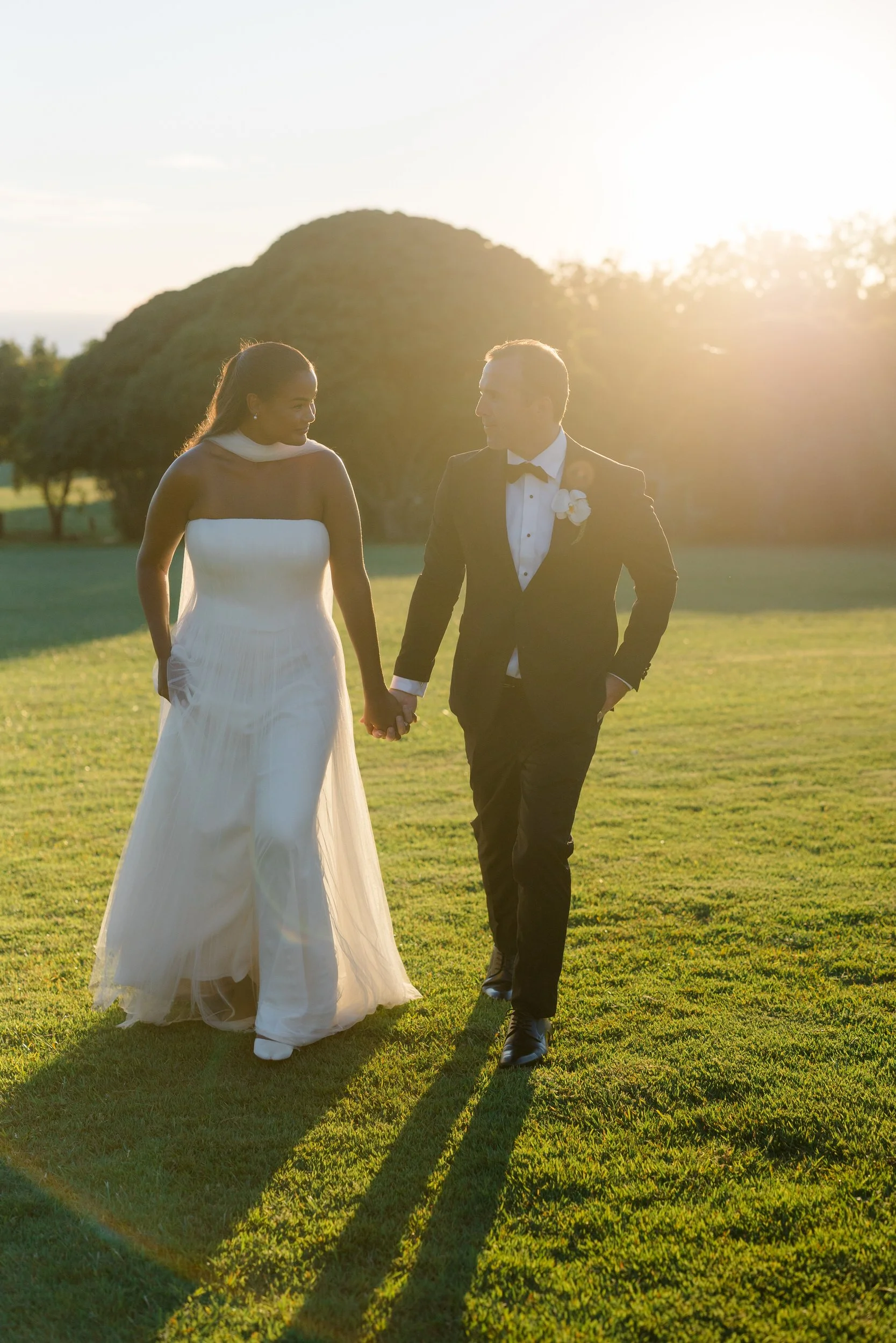 couple embracing during sunset at sunset ranch hawaii