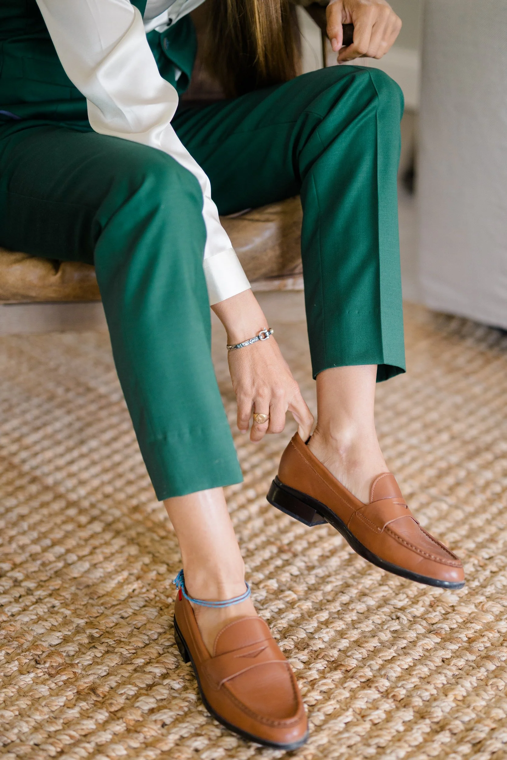 Queer wedding attire featuring a tailored green suit in the US Virgin Islands.