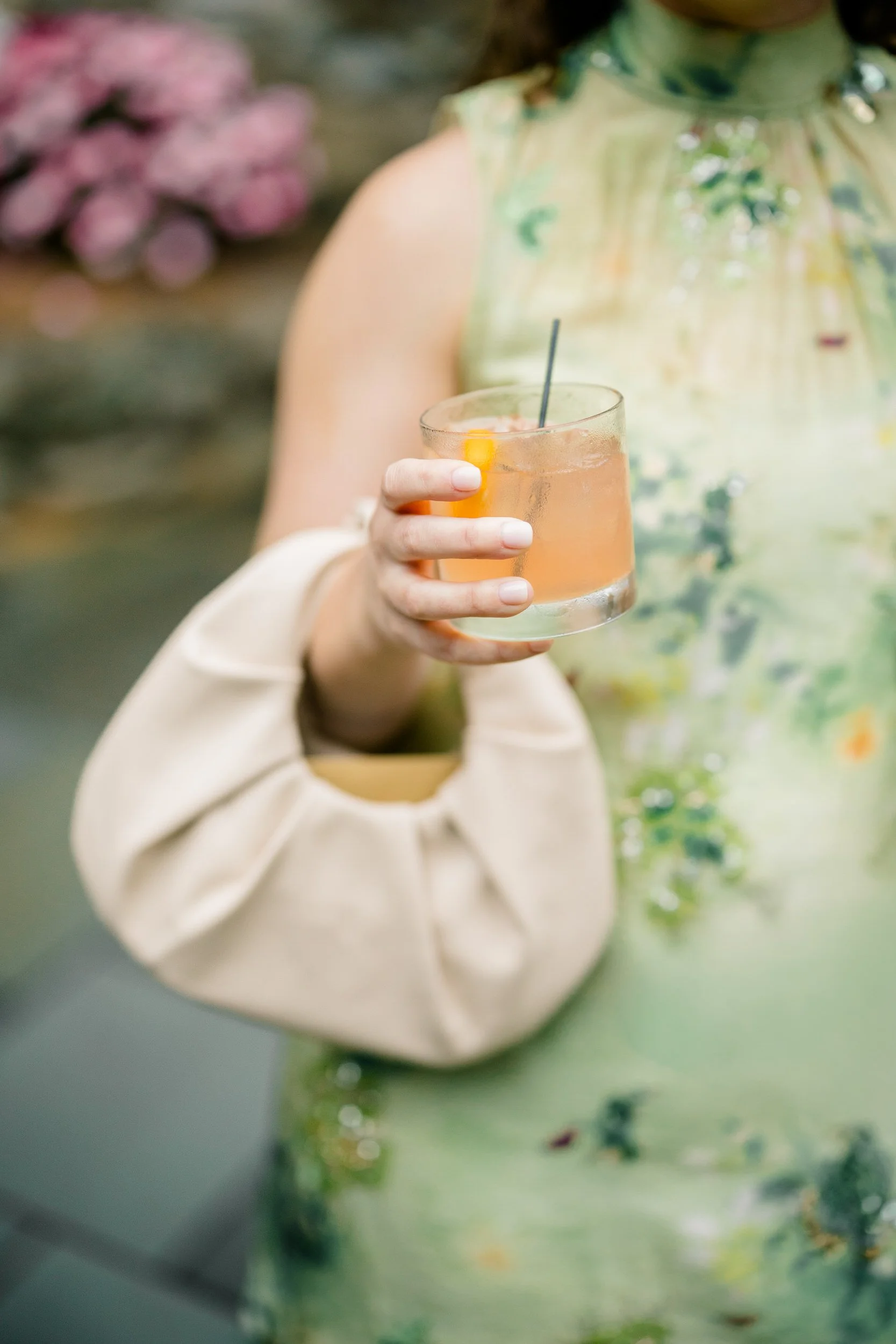 Whimsical cocktail hour filled with colorful florals and joyful wedding details.