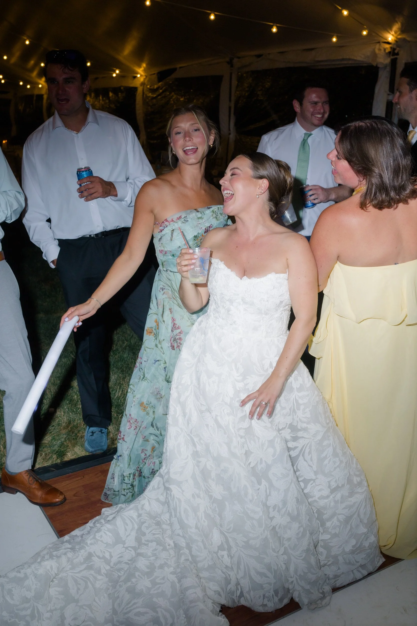 Wedding guests dancing under a tent at a Cape Cod estate.