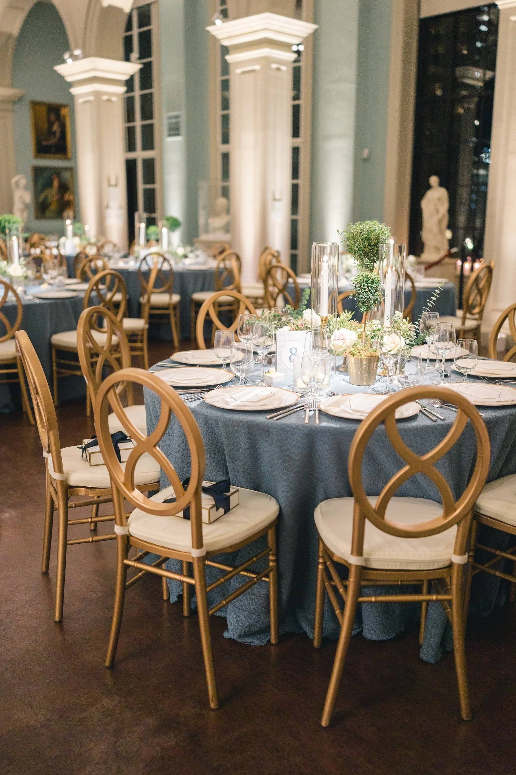 Table décor with soft florals and taper candles at the Boston Athenaeum