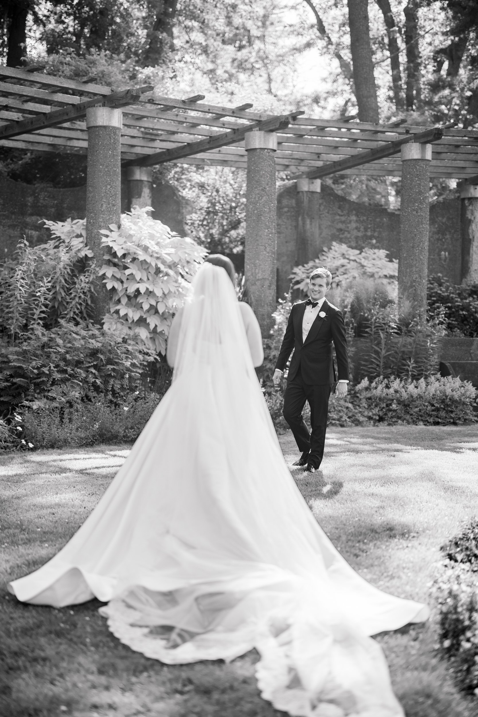 Groom’s reaction as he sees his bride for the first time in the Rose Garden at Castle Hill on the Crane Estate.