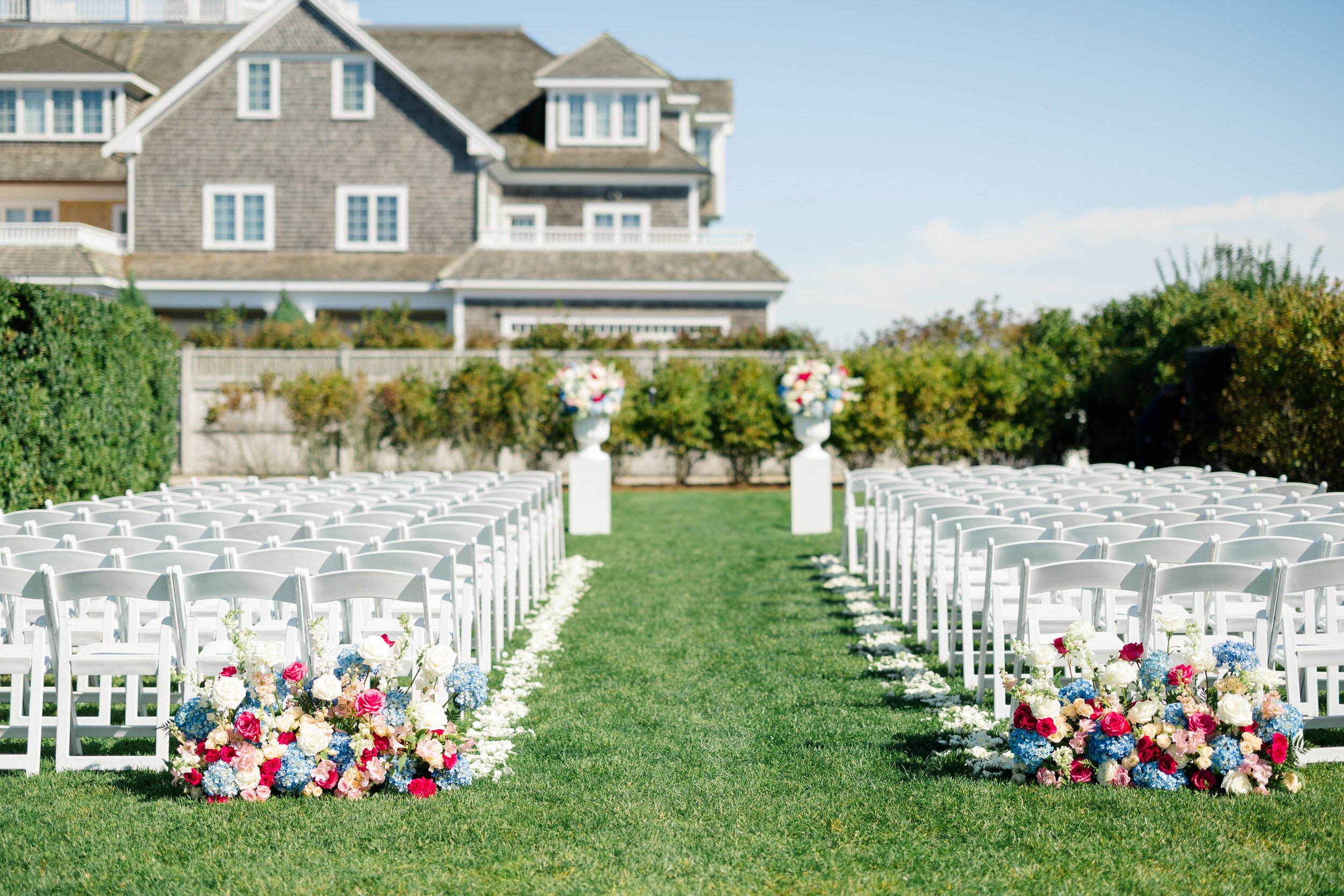 Outdoor wedding ceremony setup on the lawn at Wychmere Beach Club's Dune space.