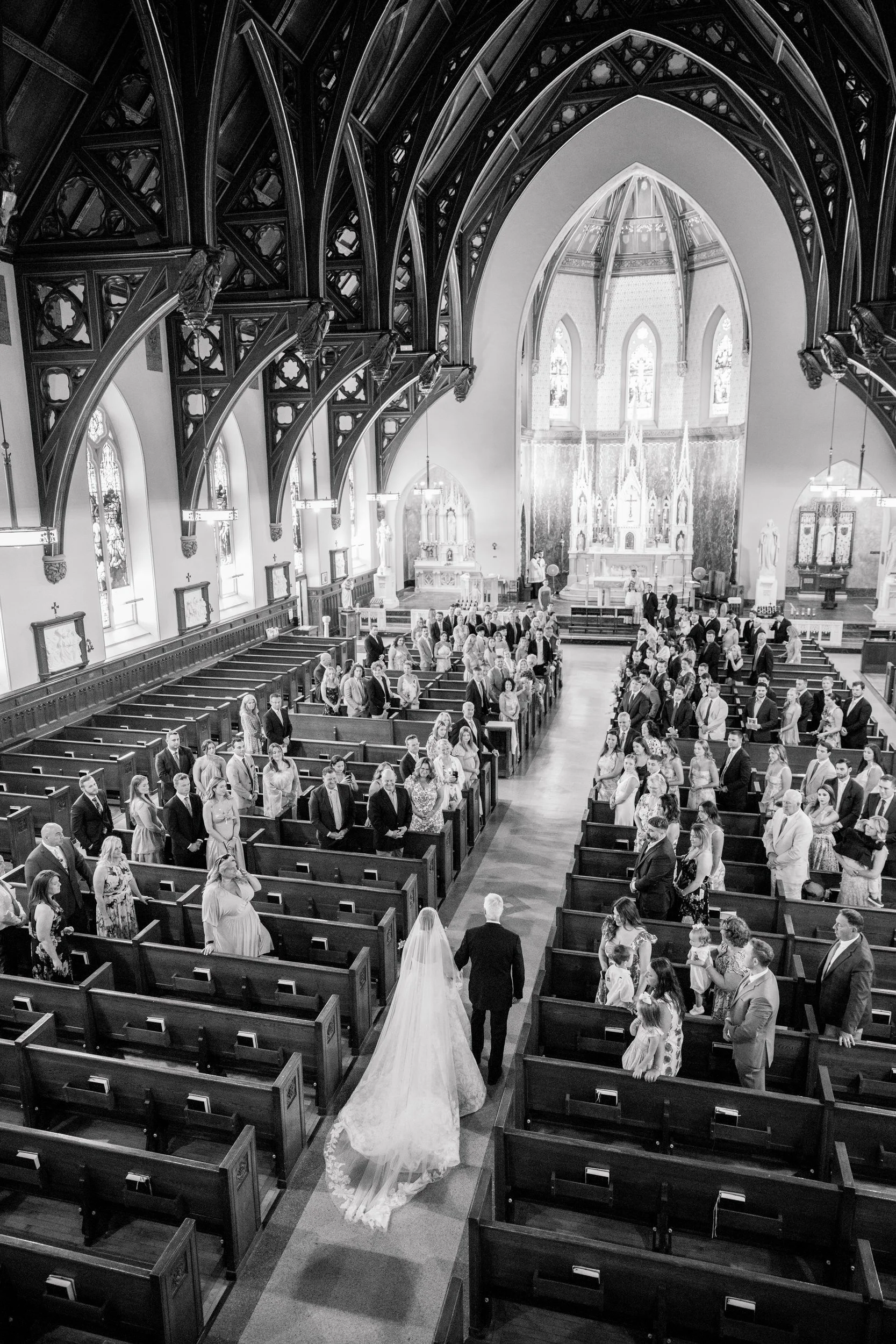 Bride walking down the aisle at St. Lawrence Martyr Parish in New Bedford.