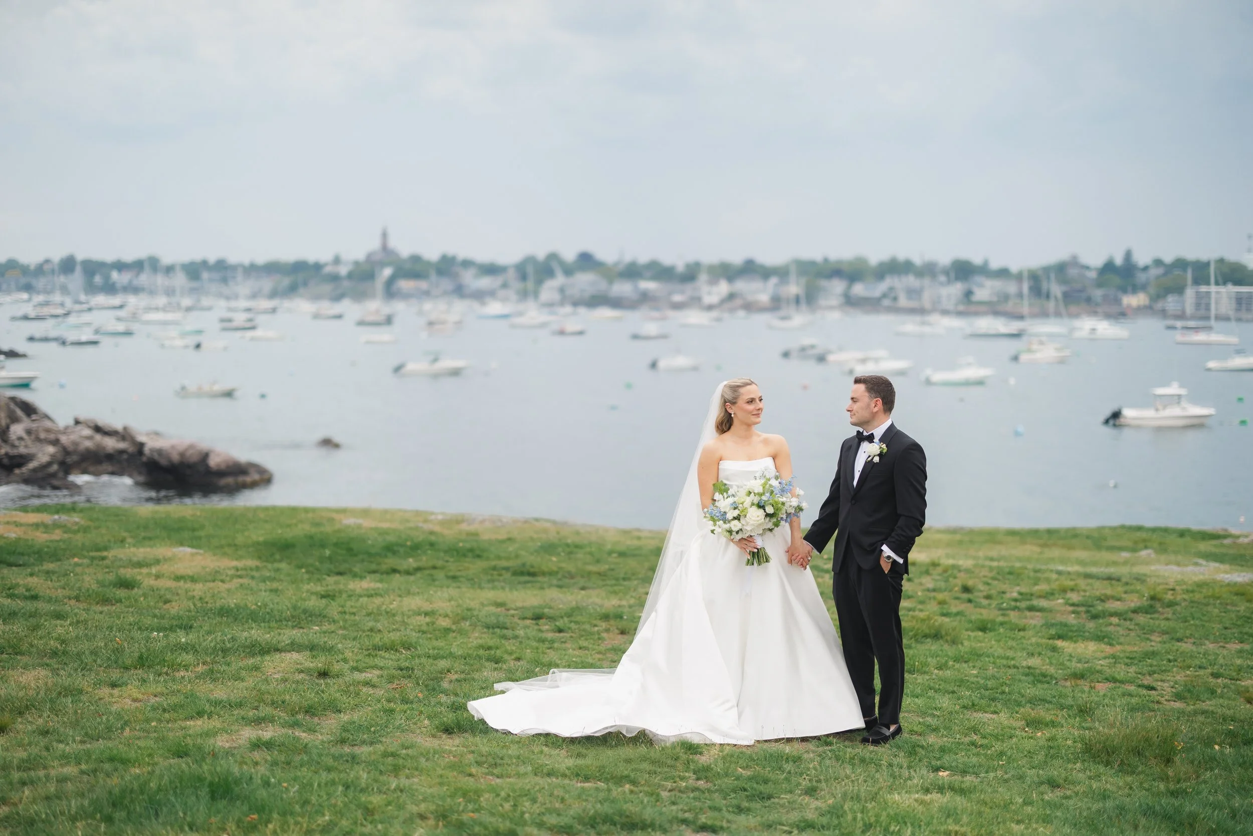 Couple portraits at Chandler Hovey Park overlooking Marblehead Harbor during a North Shore wedding.