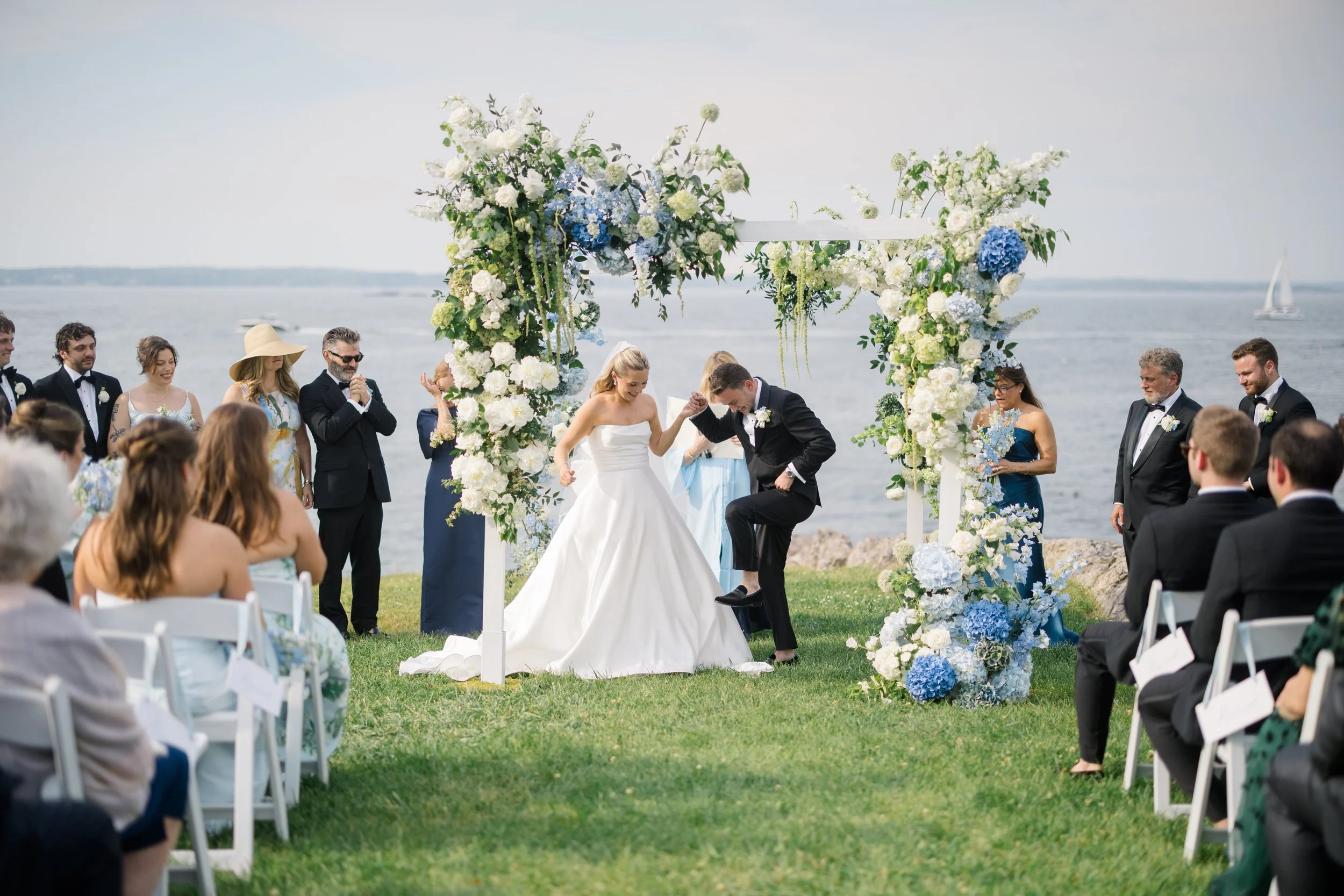 Coastal New England wedding ceremony at Chandler Hovey Park with a quartet playing along the harbor.