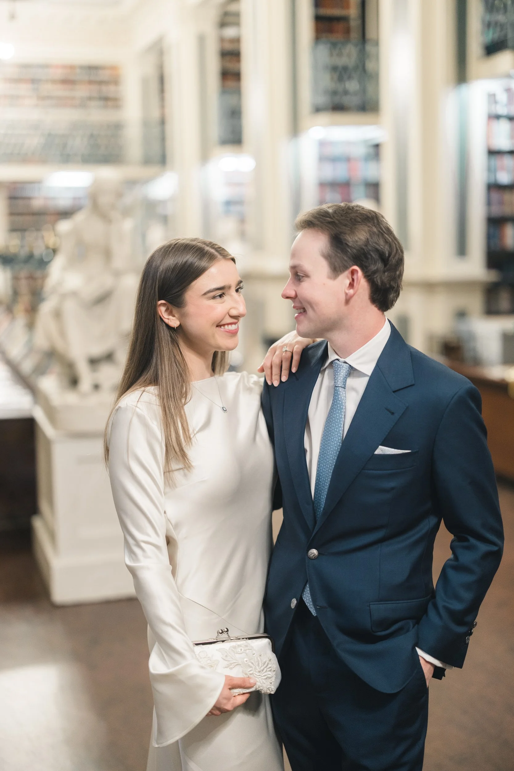 Editorial-style couple portrait in the reading room at the Boston Athenaeum