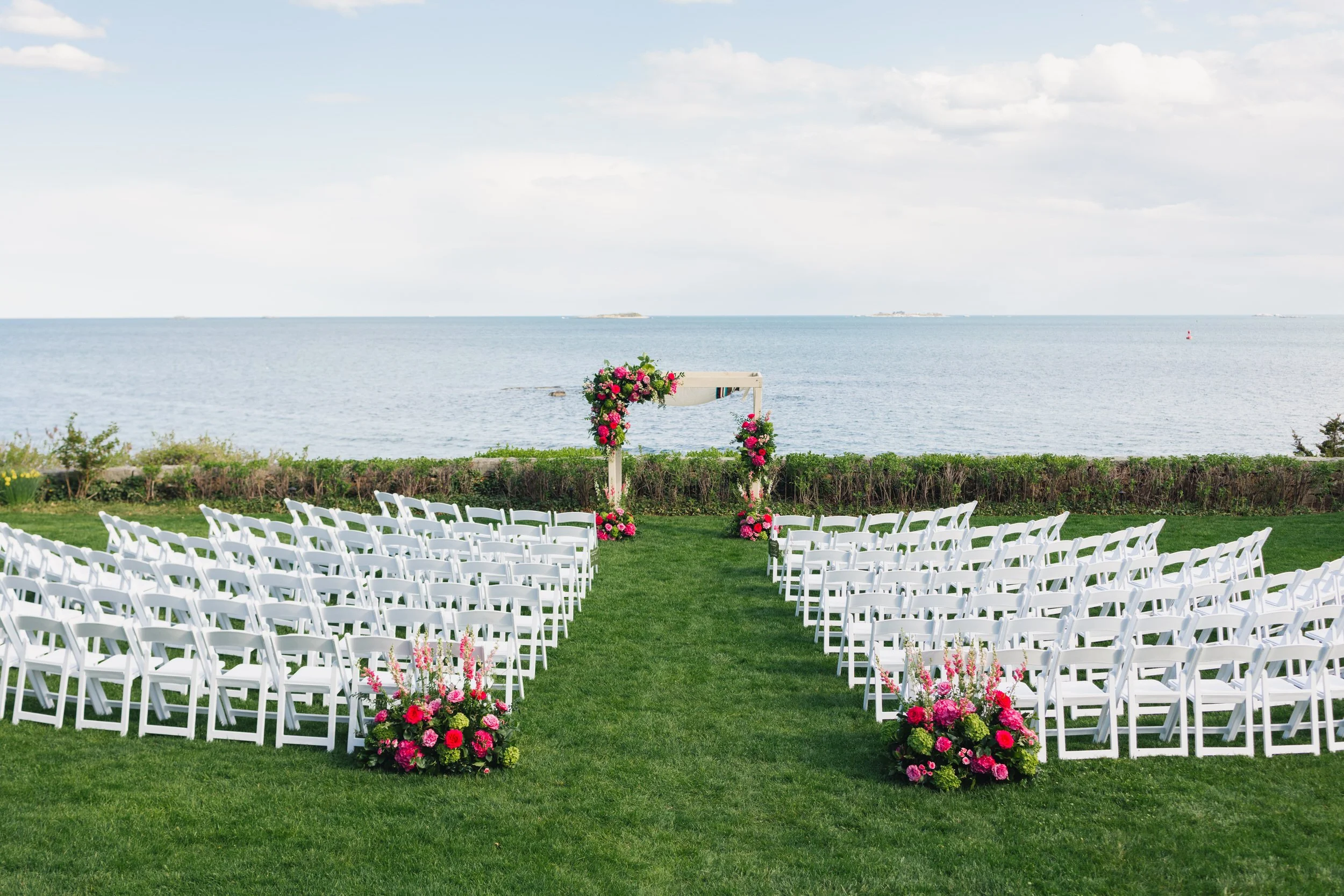 Modern wedding ceremony design with mauve, pink, and green flowers