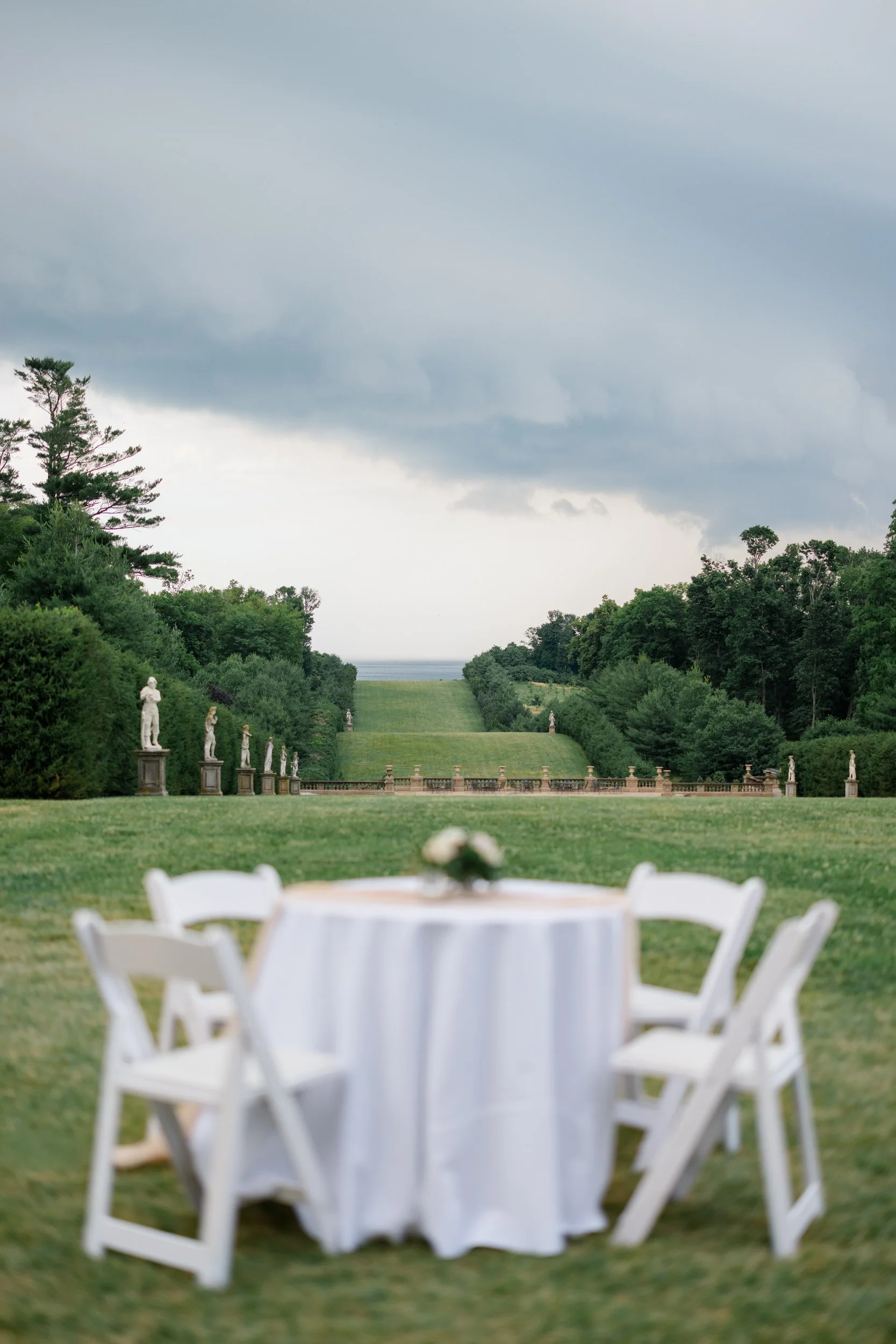 Romantic summer cocktail hour at Castle Hill on the Crane Estate with sweeping views and vibrant celebration details.