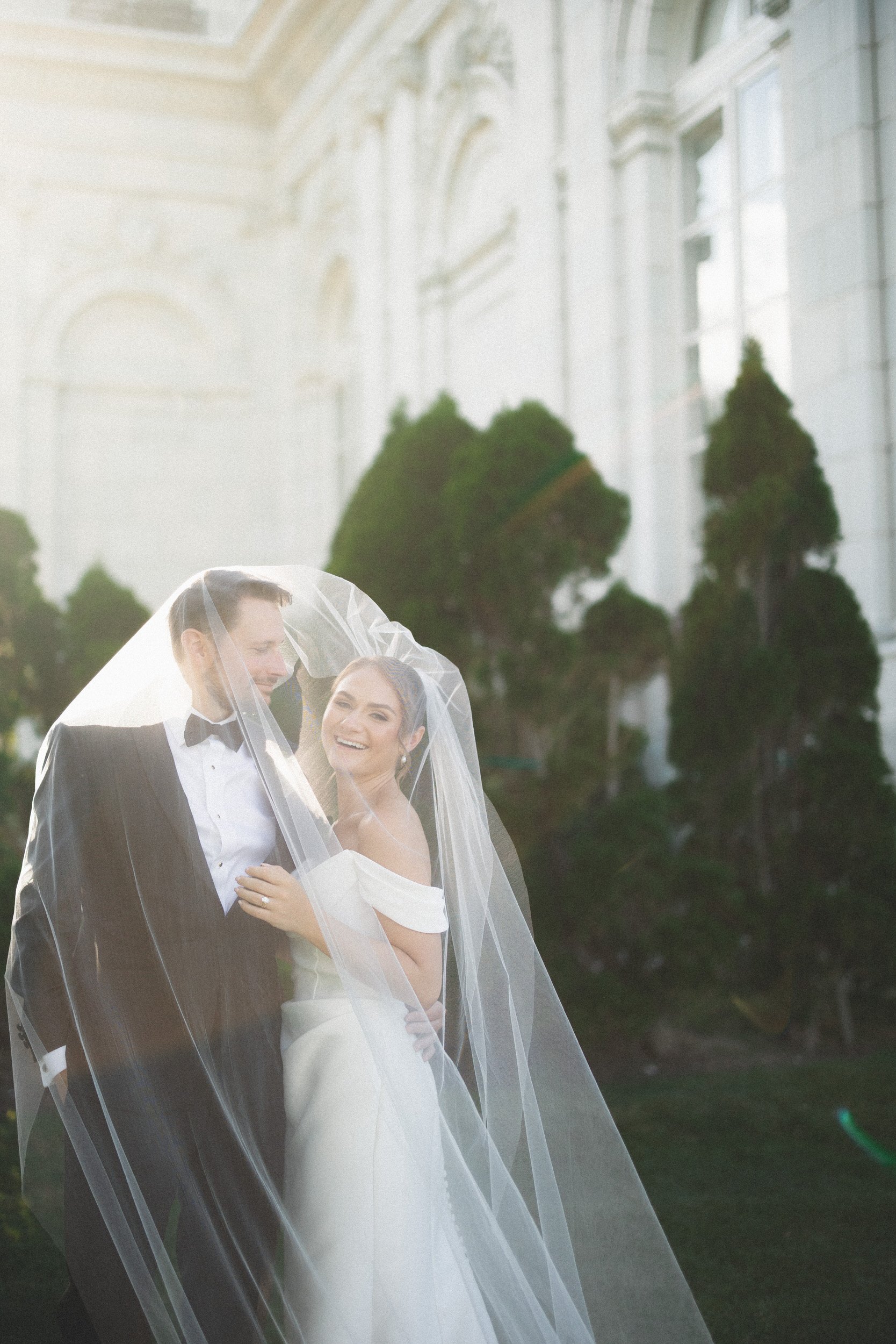 Romantic newlywed portraits at Rosecliff Mansion