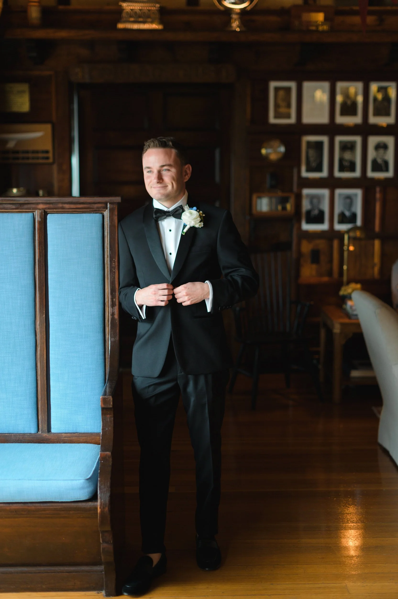The groom getting ready at Corinthian Yacht Club in Marblehead, Massachusetts before a coastal waterfront wedding celebration.